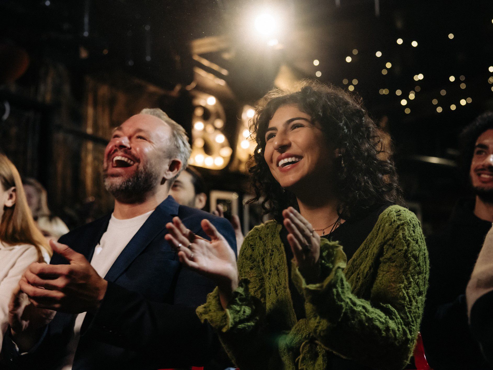 audience laughing in the crowd