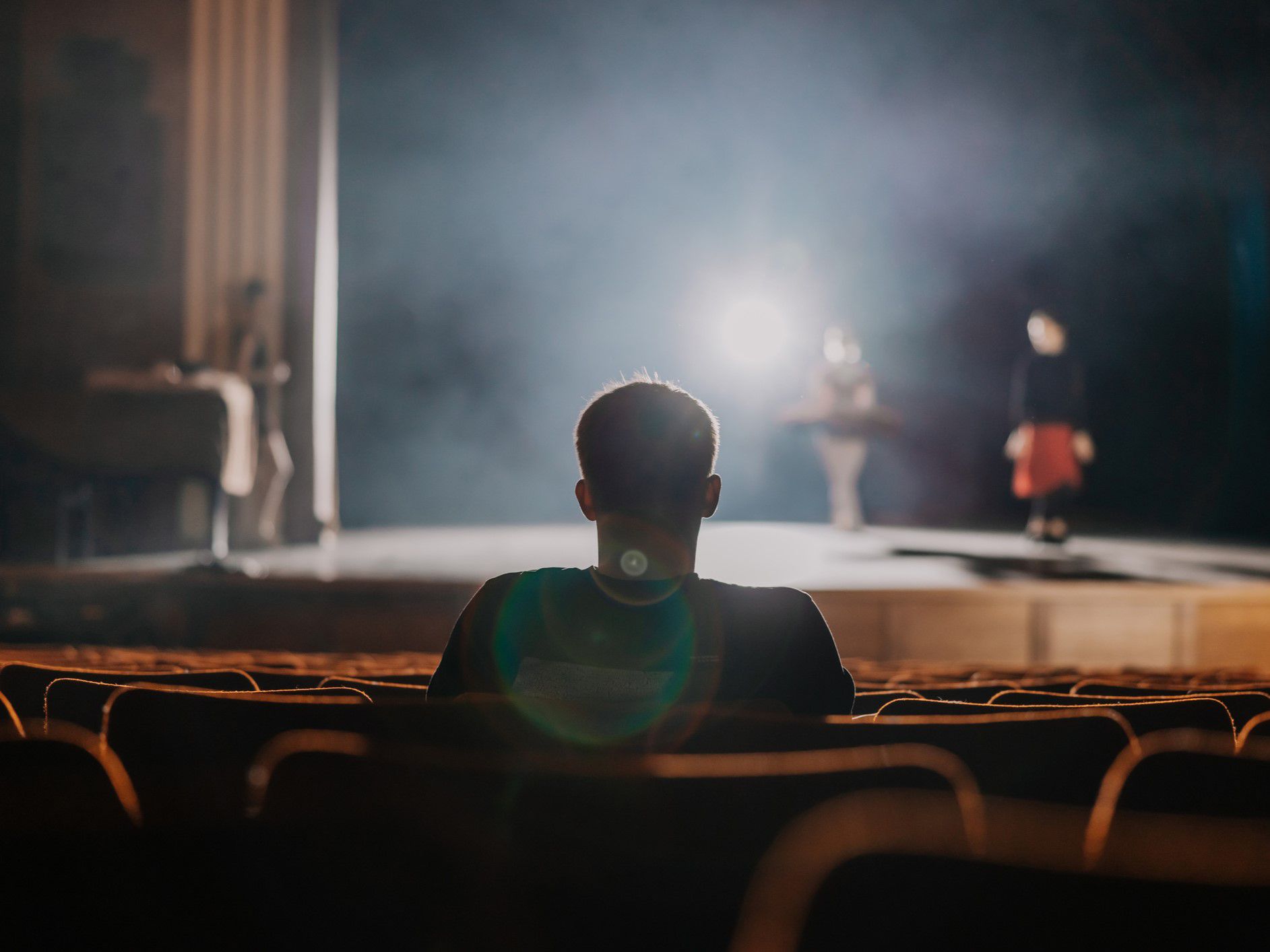 young man watching a play