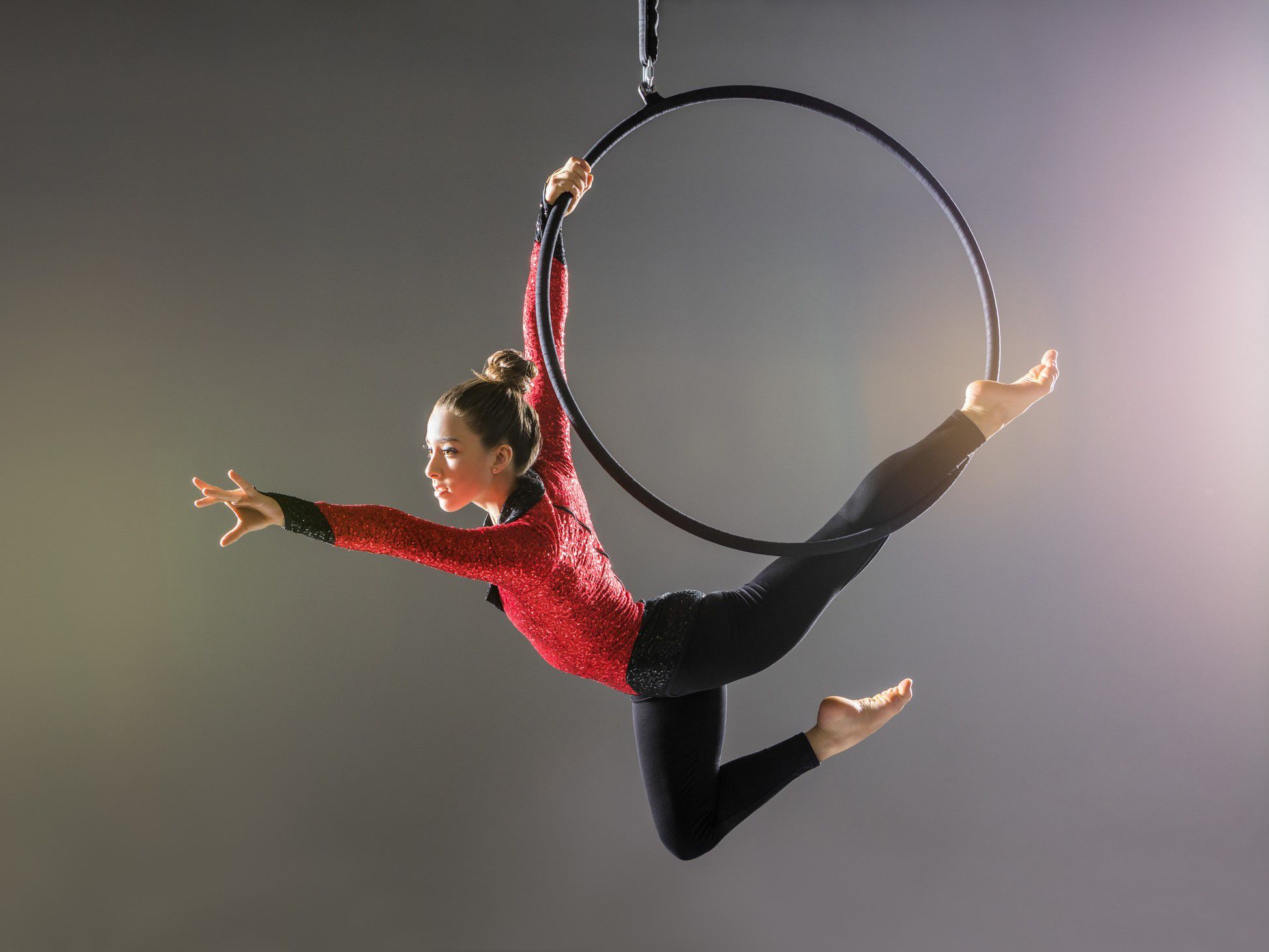 Circus performer suspended from the ceiling