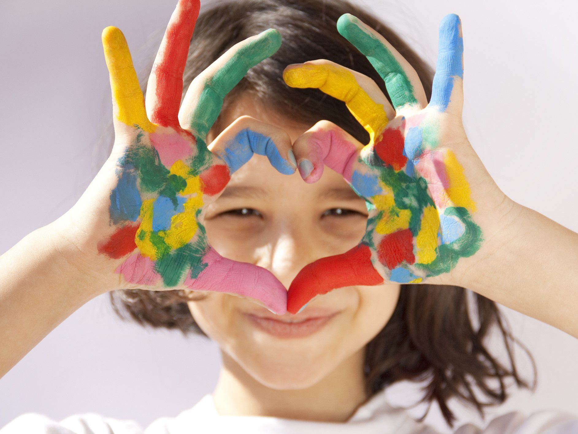 Kid with paint on their hands