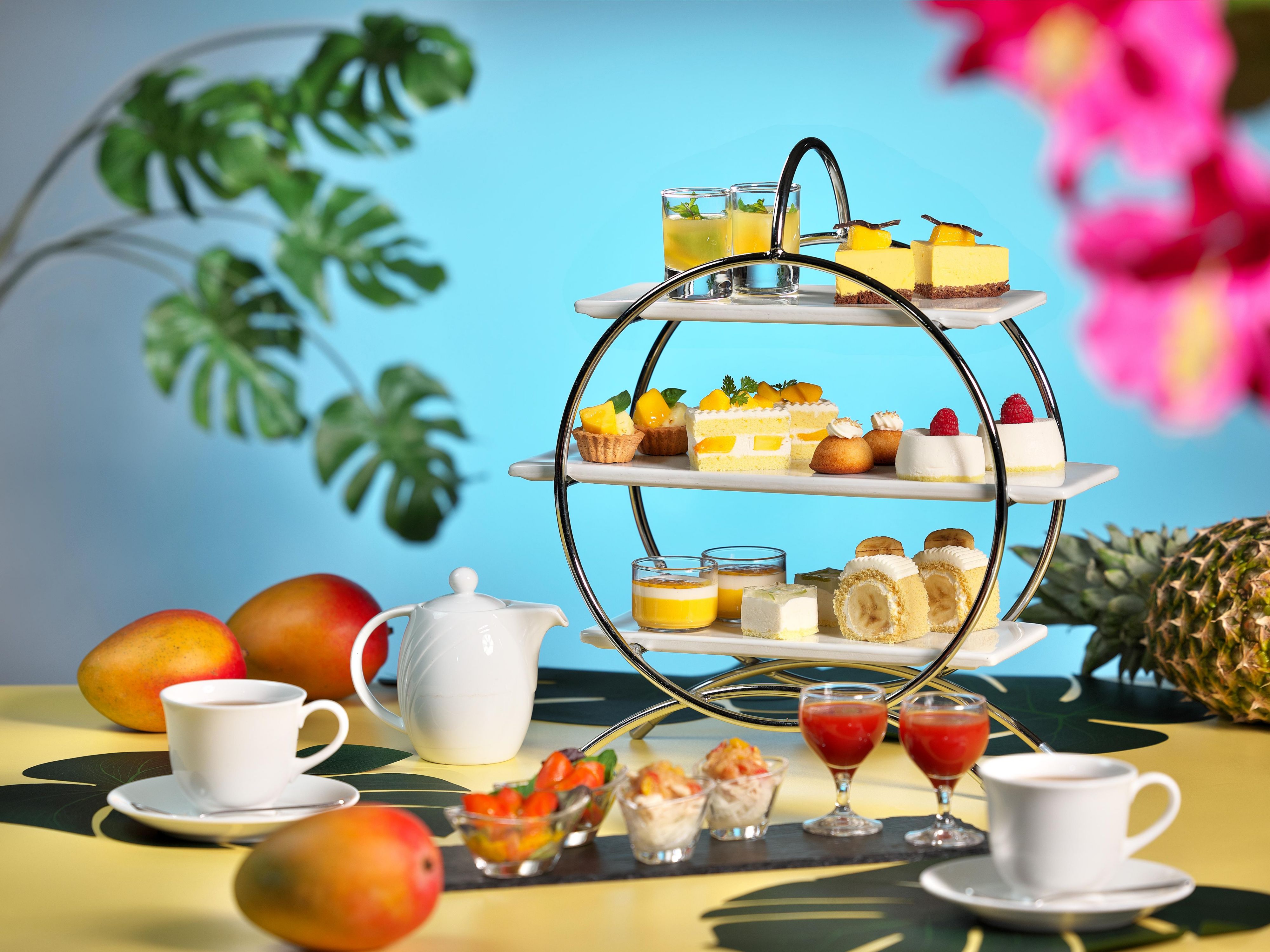 Delight in our Summer Afternoon Tea, featuring vibrant tropical fruit sweets in radiant shades of yellow. Indulge in three varieties of all you can eat scones, perfectly paired with your desserts, and enjoy a relaxing afternoon in the cool comfort of our restaurant.