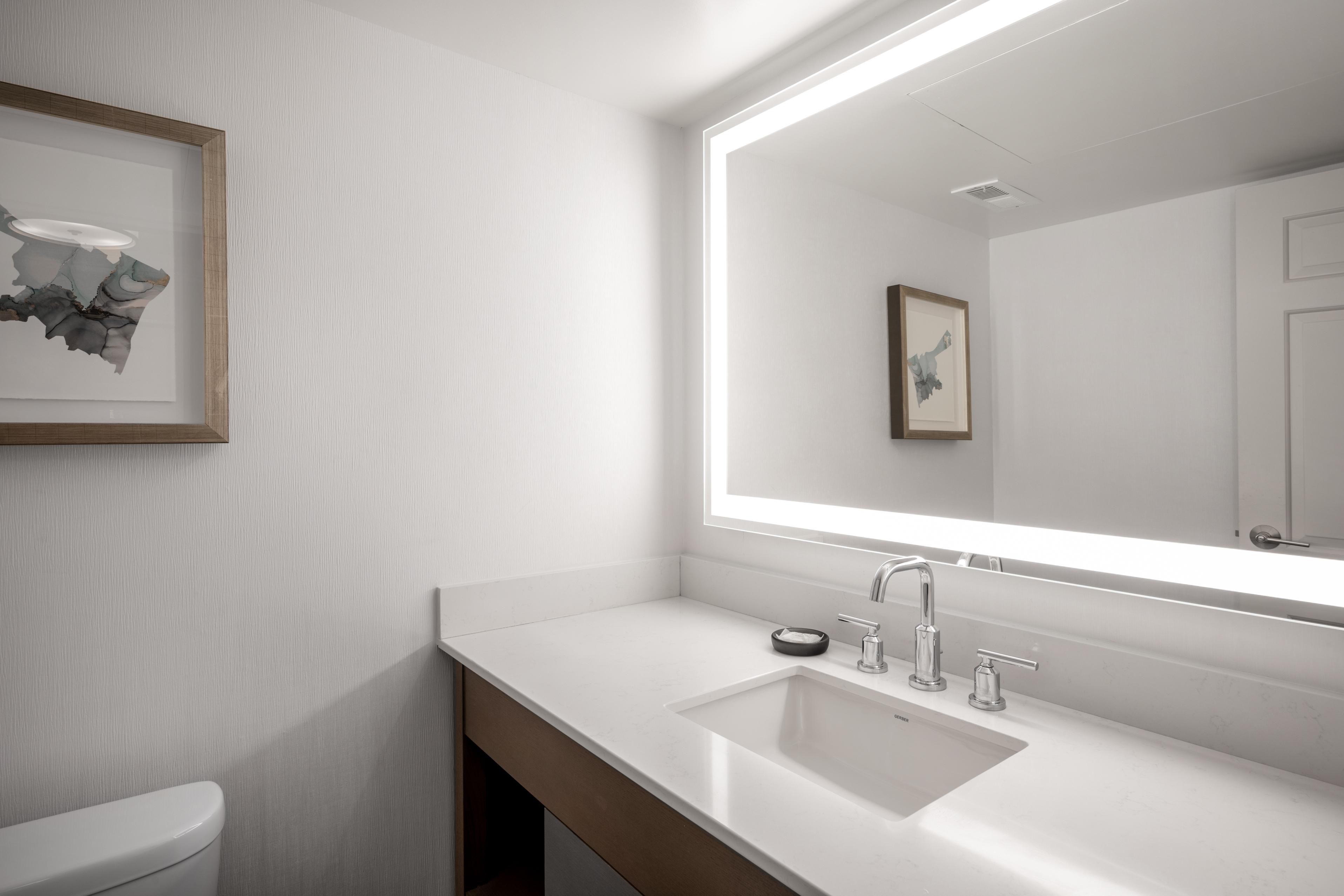Enjoy an additional half bath powder room in specific suites