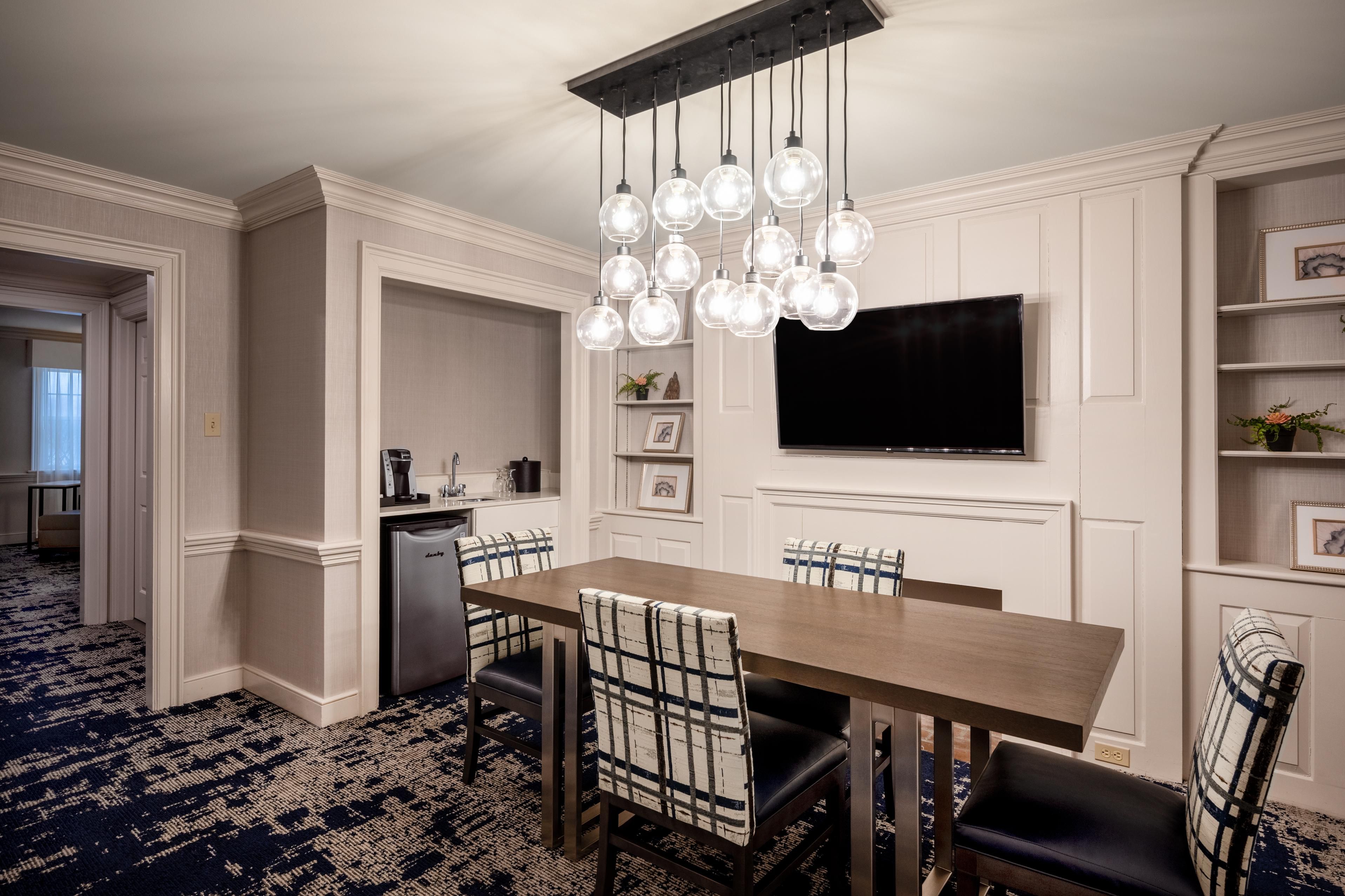 Relax in our two level Presidential Suite dining room with wet bar