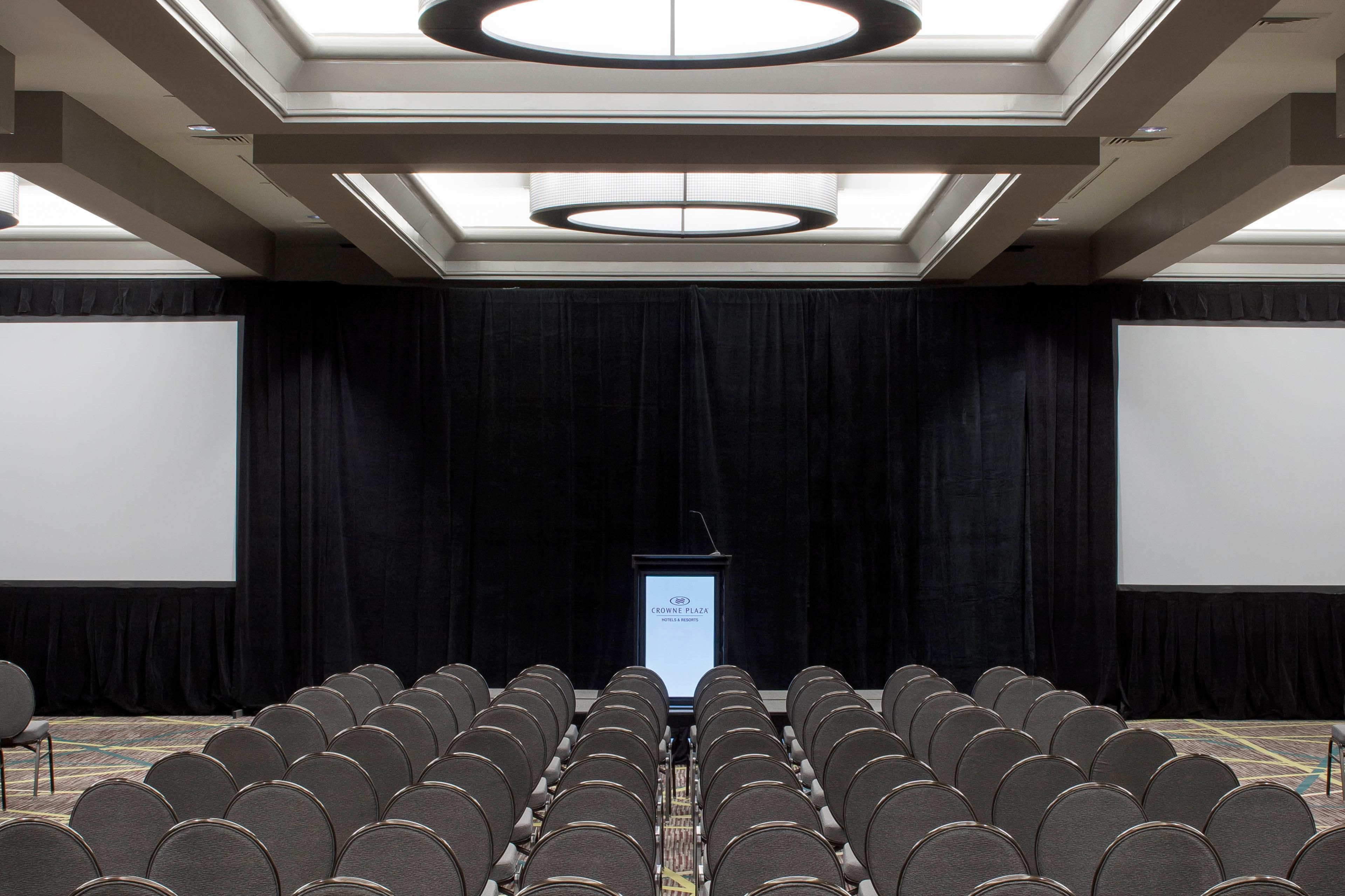 Large conference room with chairs and projectors