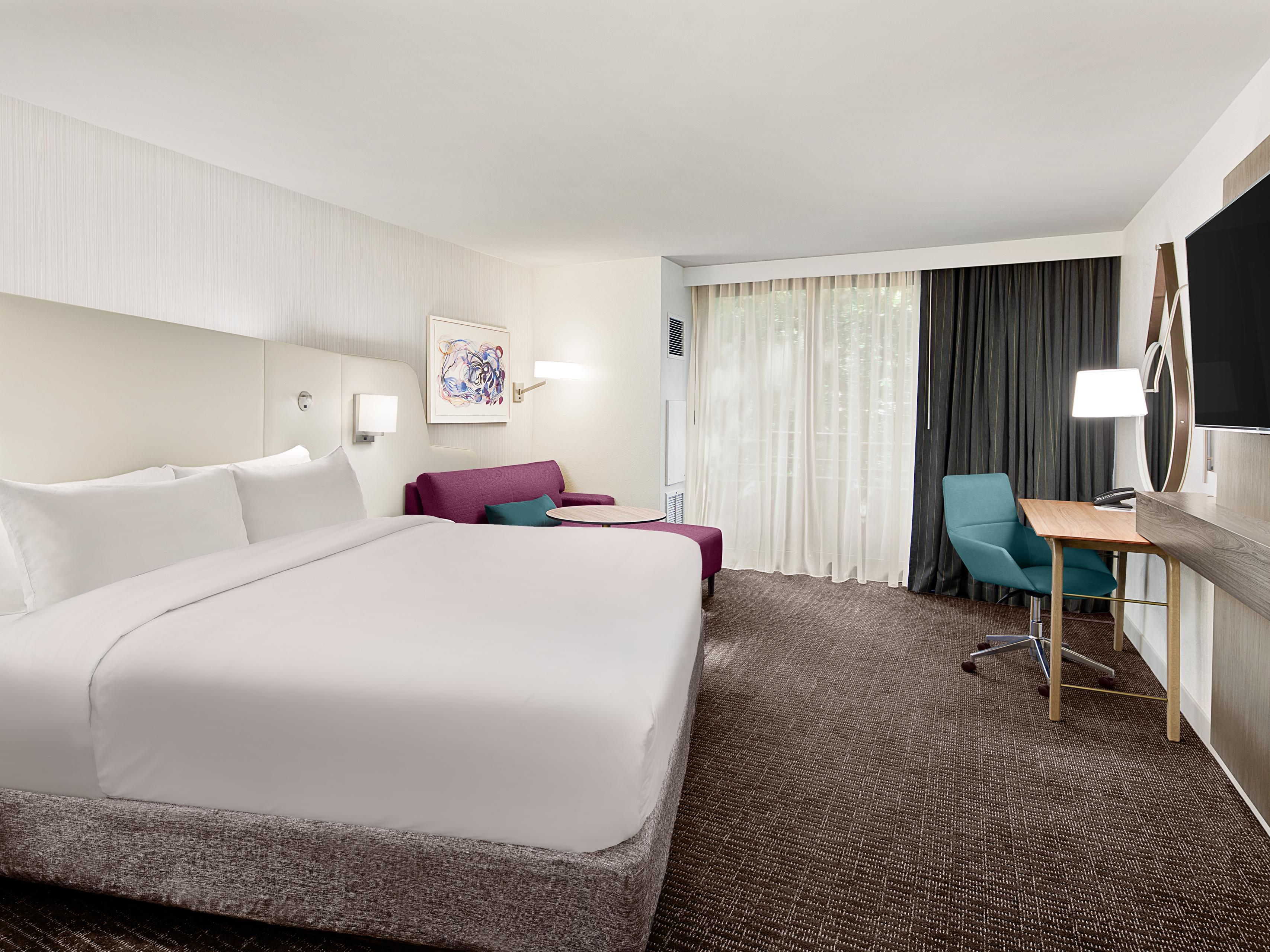 Recharge in our newly redesigned WorkLife Rooms, built for both focus and relaxation with a cocooning headboard, skyline views, and a dynamic sofa nook. Upgrade to one of our 30 spacious suites, each offering a separate living area, premium amenities, and three luxurious presidential-style suites perfect for extended stays or special occasions.