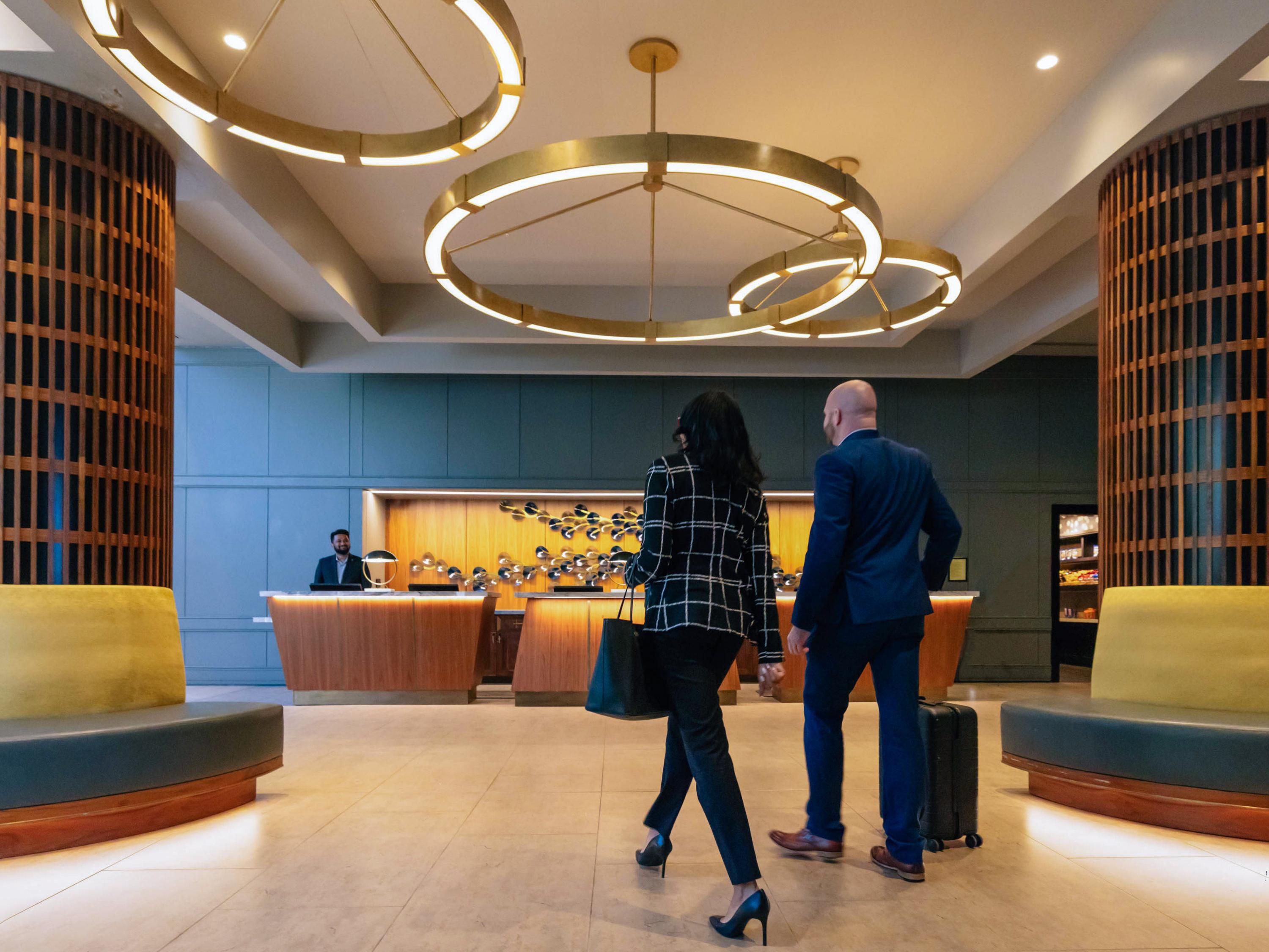people walking in hotel lobby