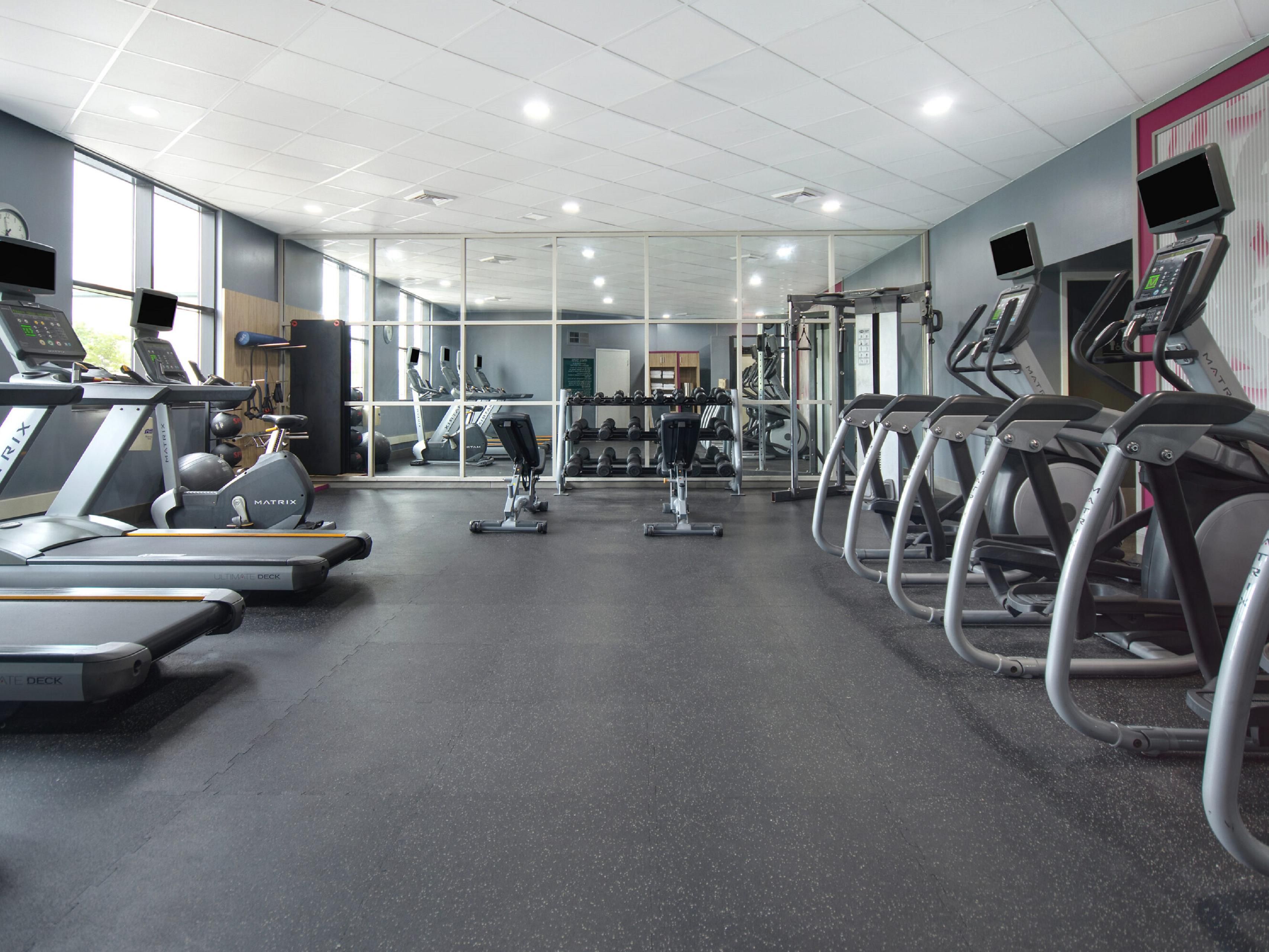 Fitness center with cardio equipment.