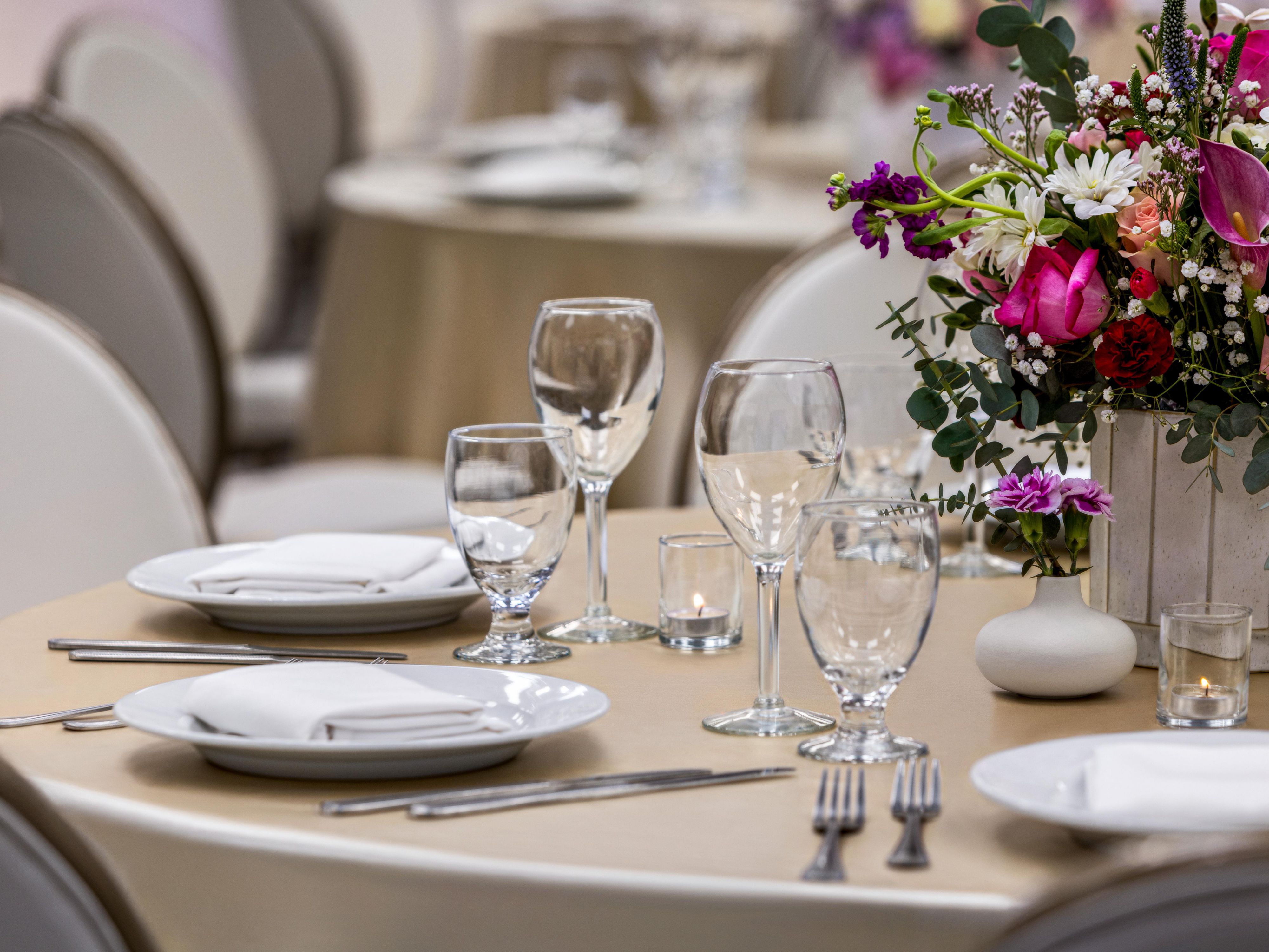 Table set for event with dishware and flowers