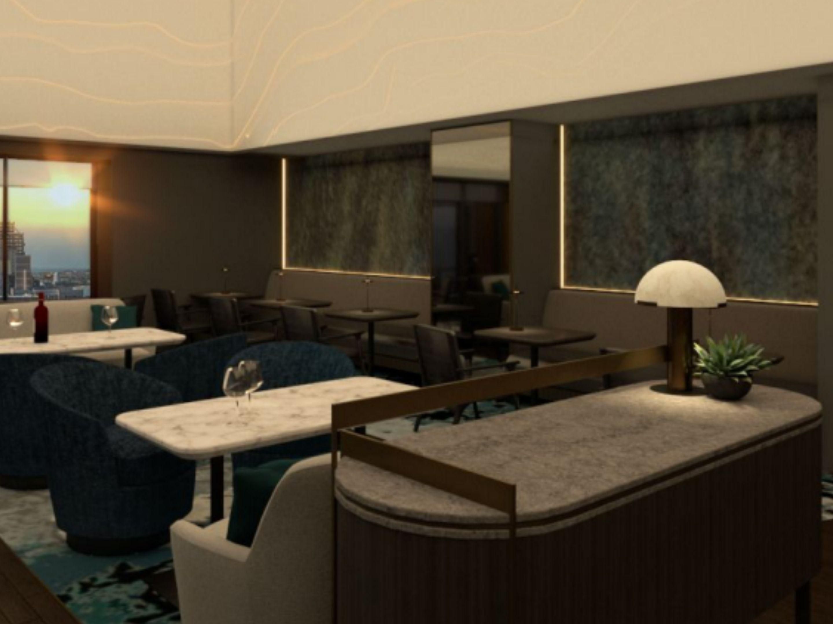 Meticulously designed, the Executive Lounge represents a blend of contemporary elegance and urban luxury. 
Whether you seek a respite from the bustling world or a sophisticated setting to savour a glass of wine, we invite you to experience the Executive Lounge; where the views are endless, the ambiance is inviting, and relaxation thrives. 