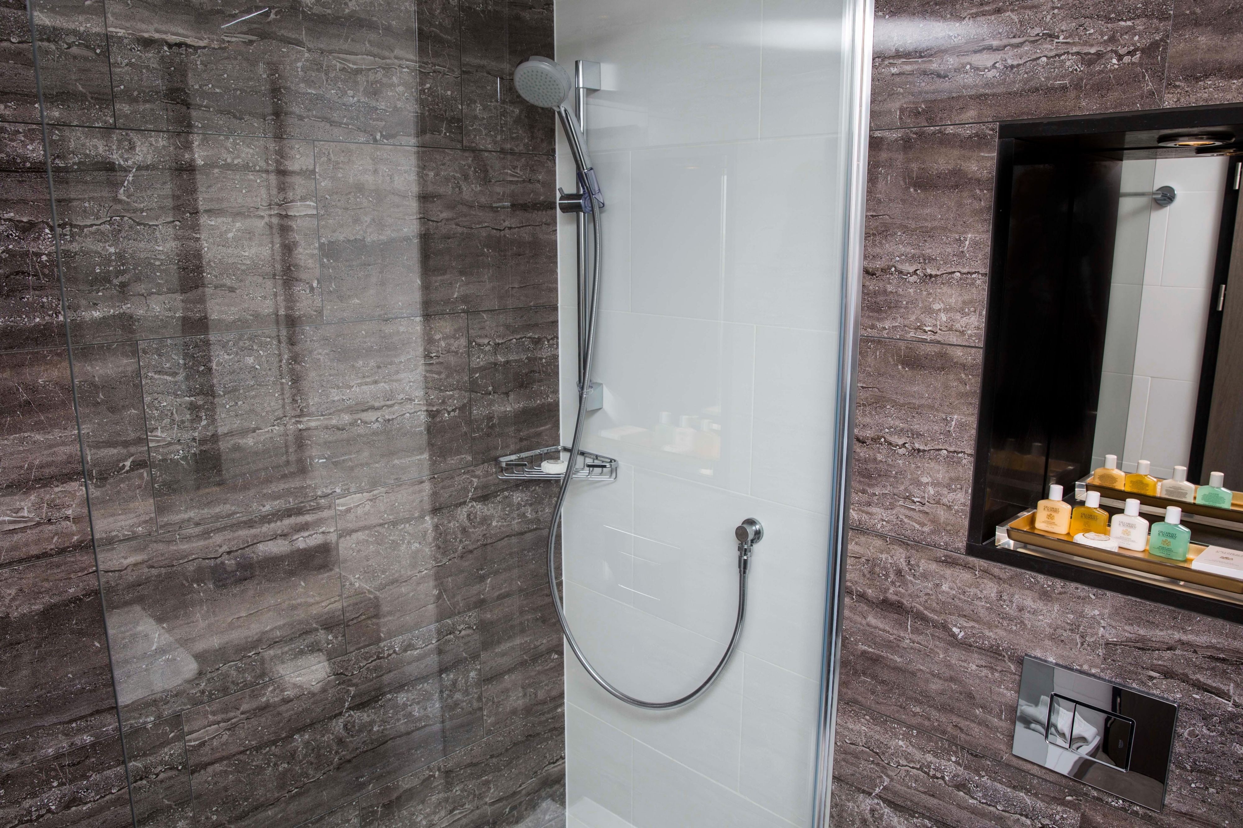 Modern spacious bathrooms with a powerful shower.