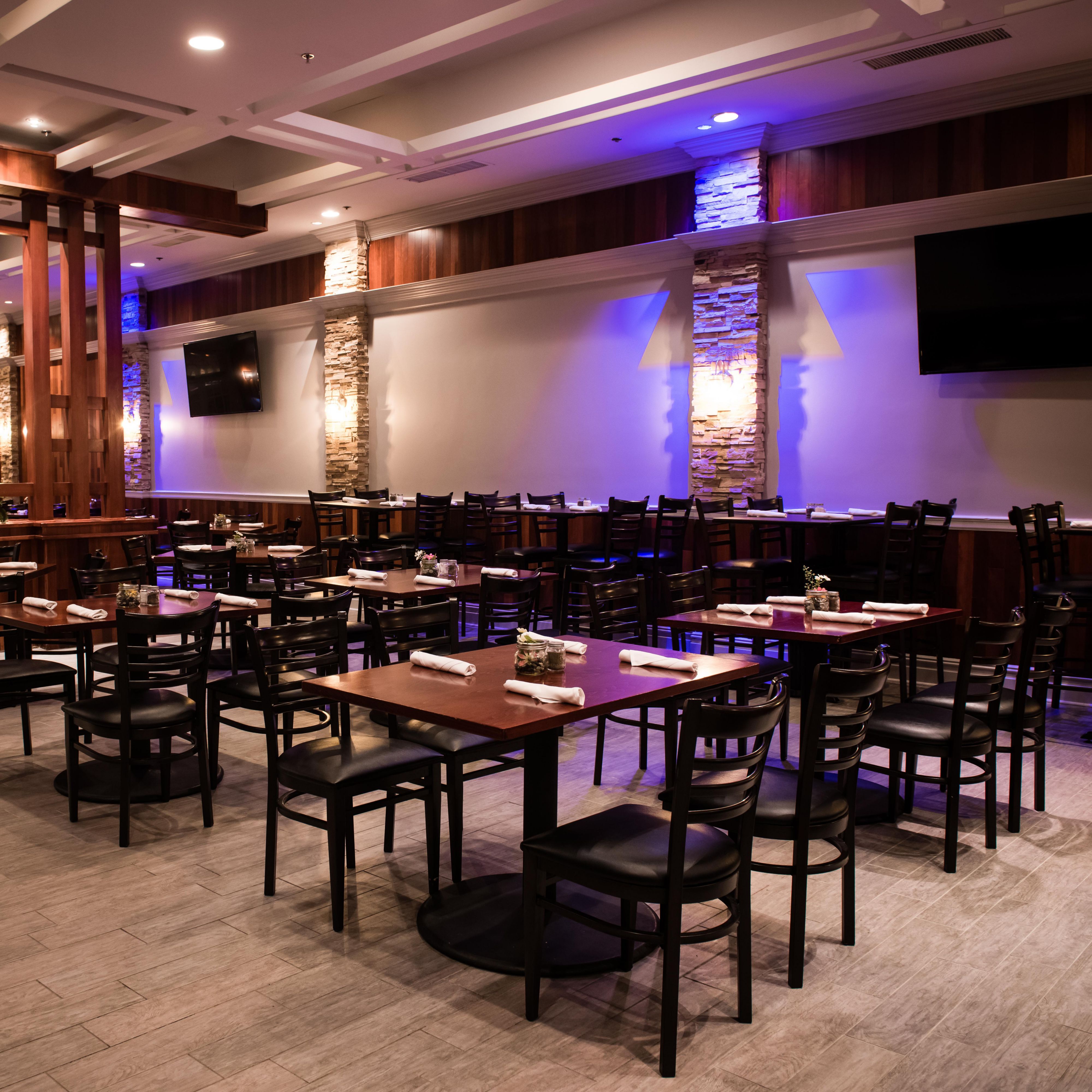 Embers Restaurant featuring spacious seating and TVs throughout