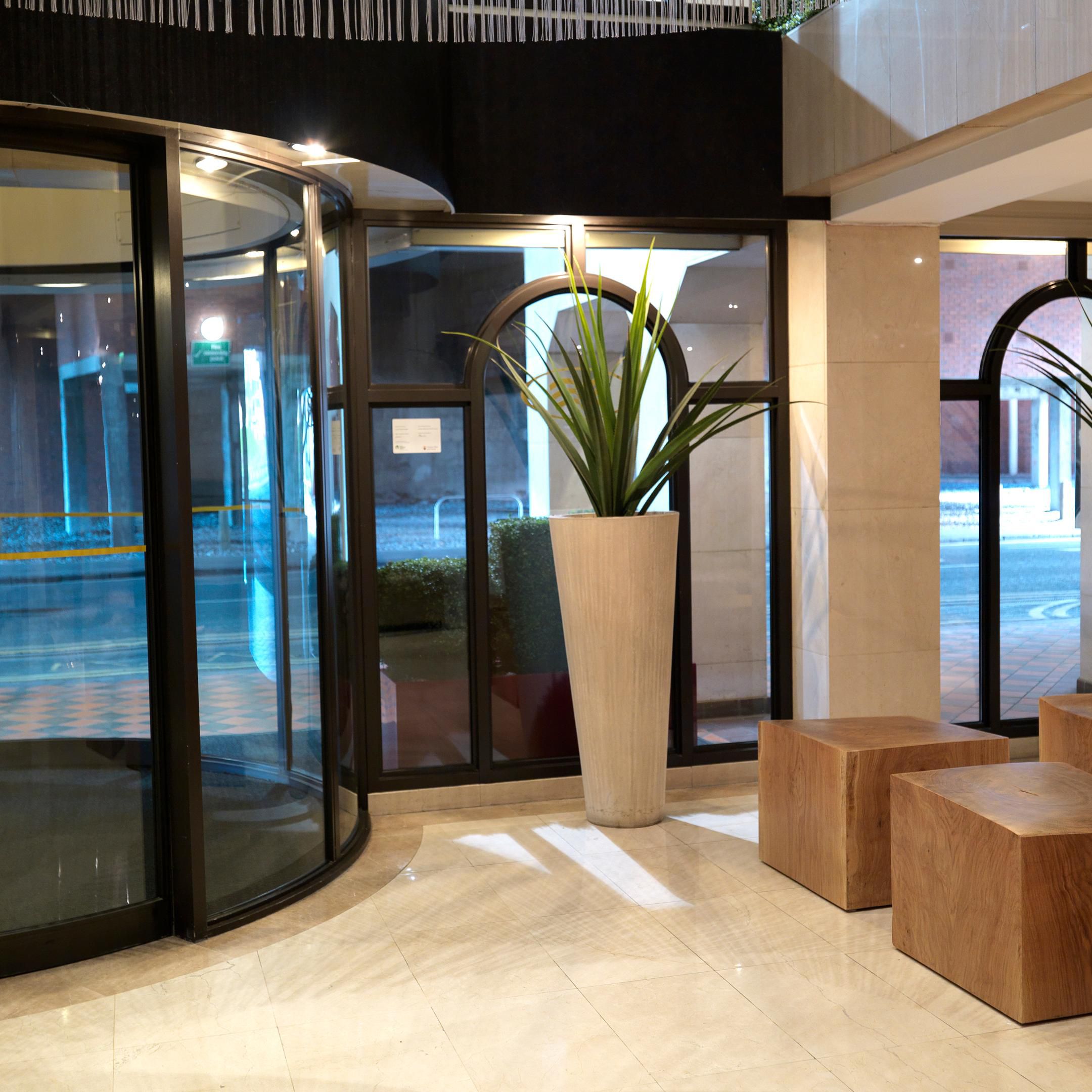 Hotel Entrance with carved wooden seats