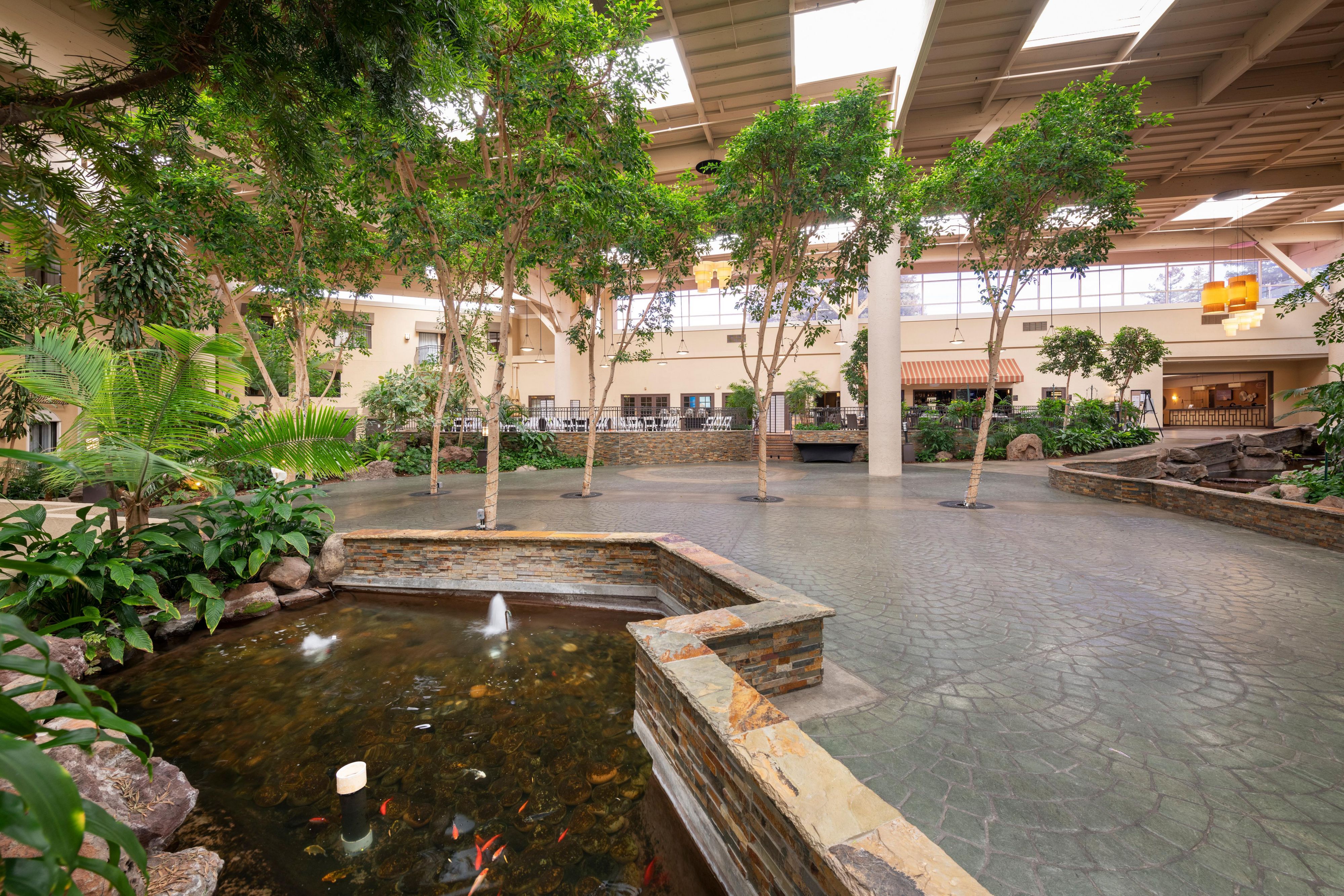 The Atrium features lush greenery space and Koi ponds