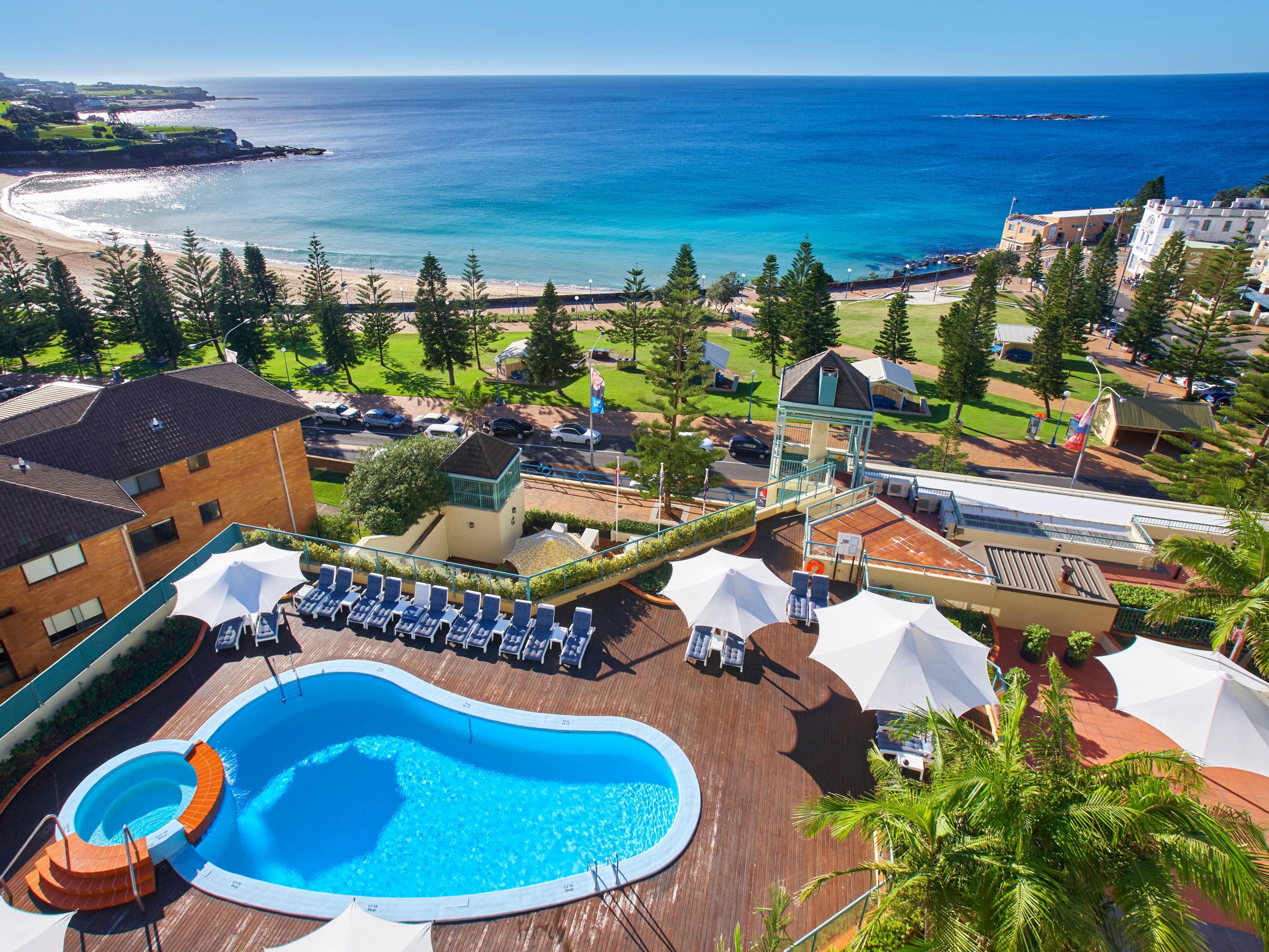 Enjoy the pool deck with views out to the ocean.