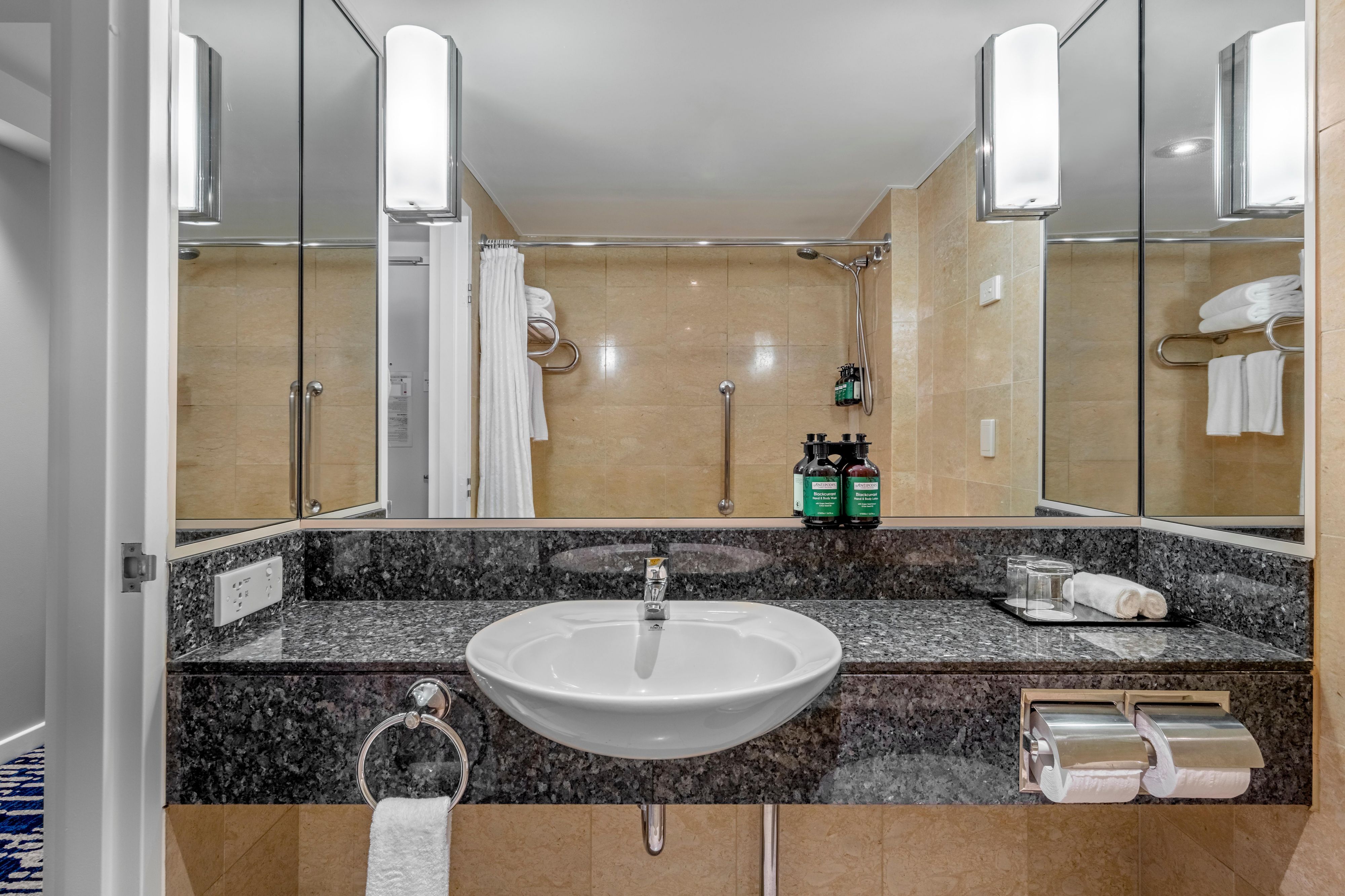 Classic bathroom with Antipodes amenities and shower over bath