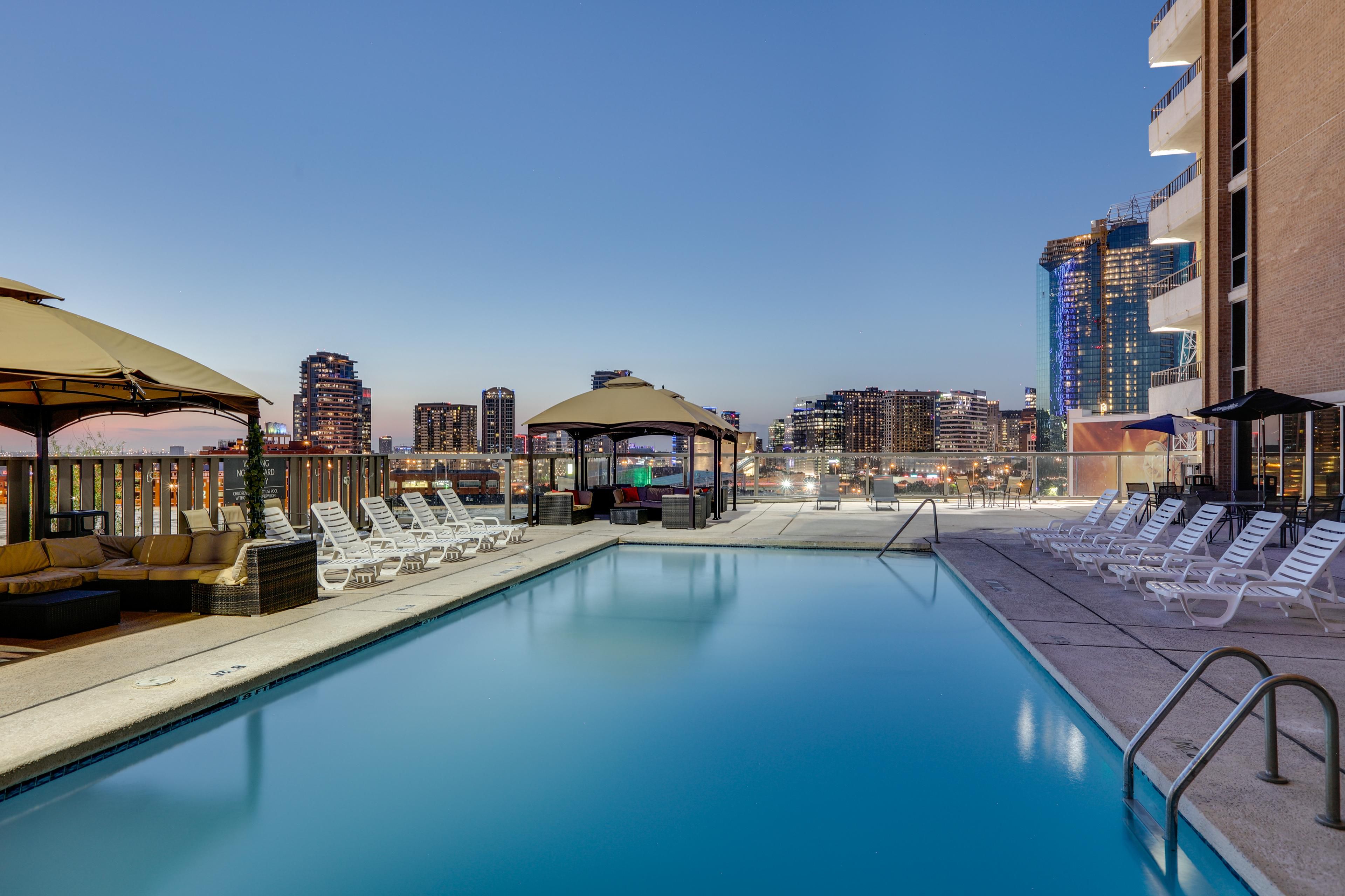 Float above Dallas with skyline views at our hotel rooftop pool.