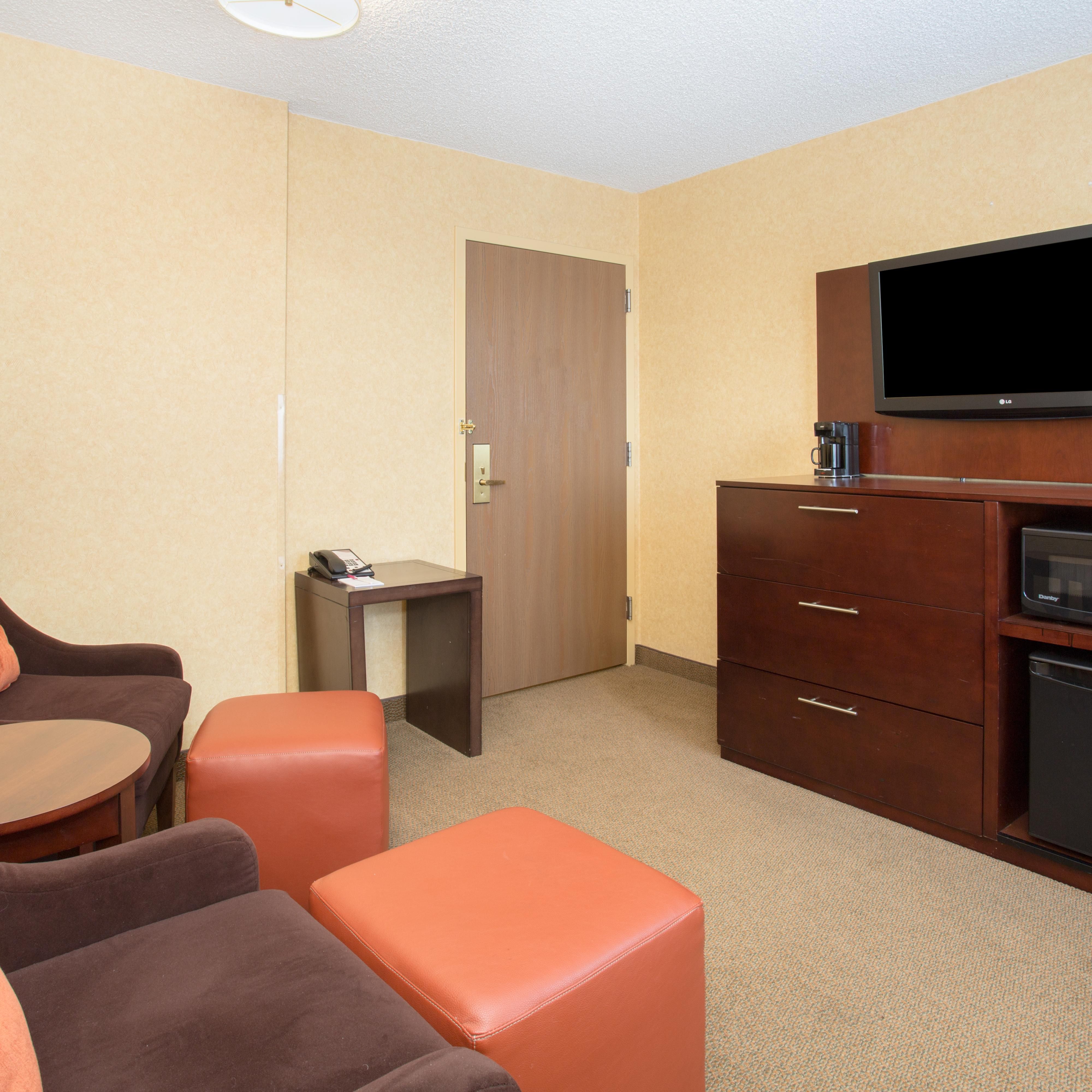 Unwind in your suite&#39;s living area while you watch a TV show.
