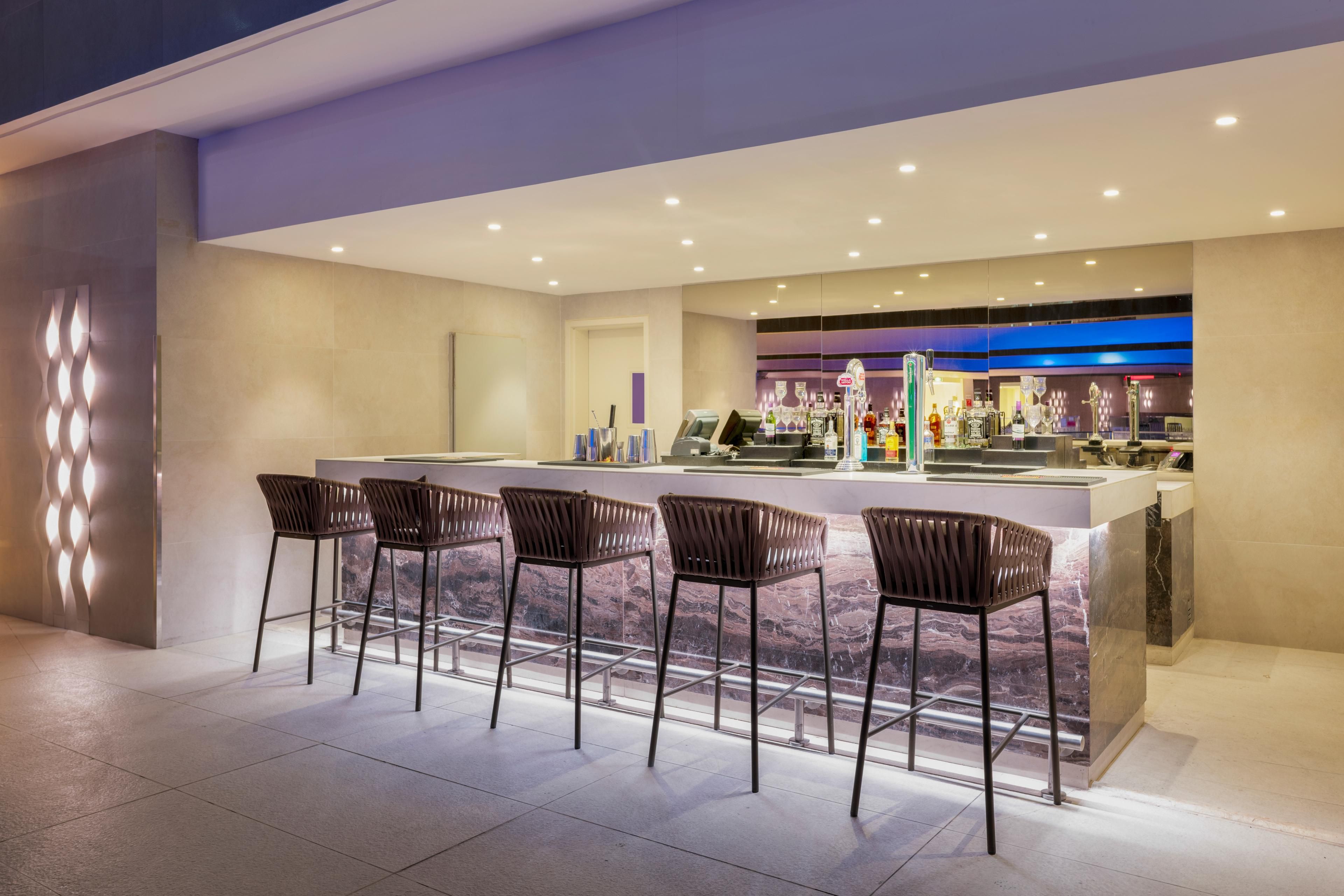 Liquidity poolside lounge has a bar and restaurant seating options
