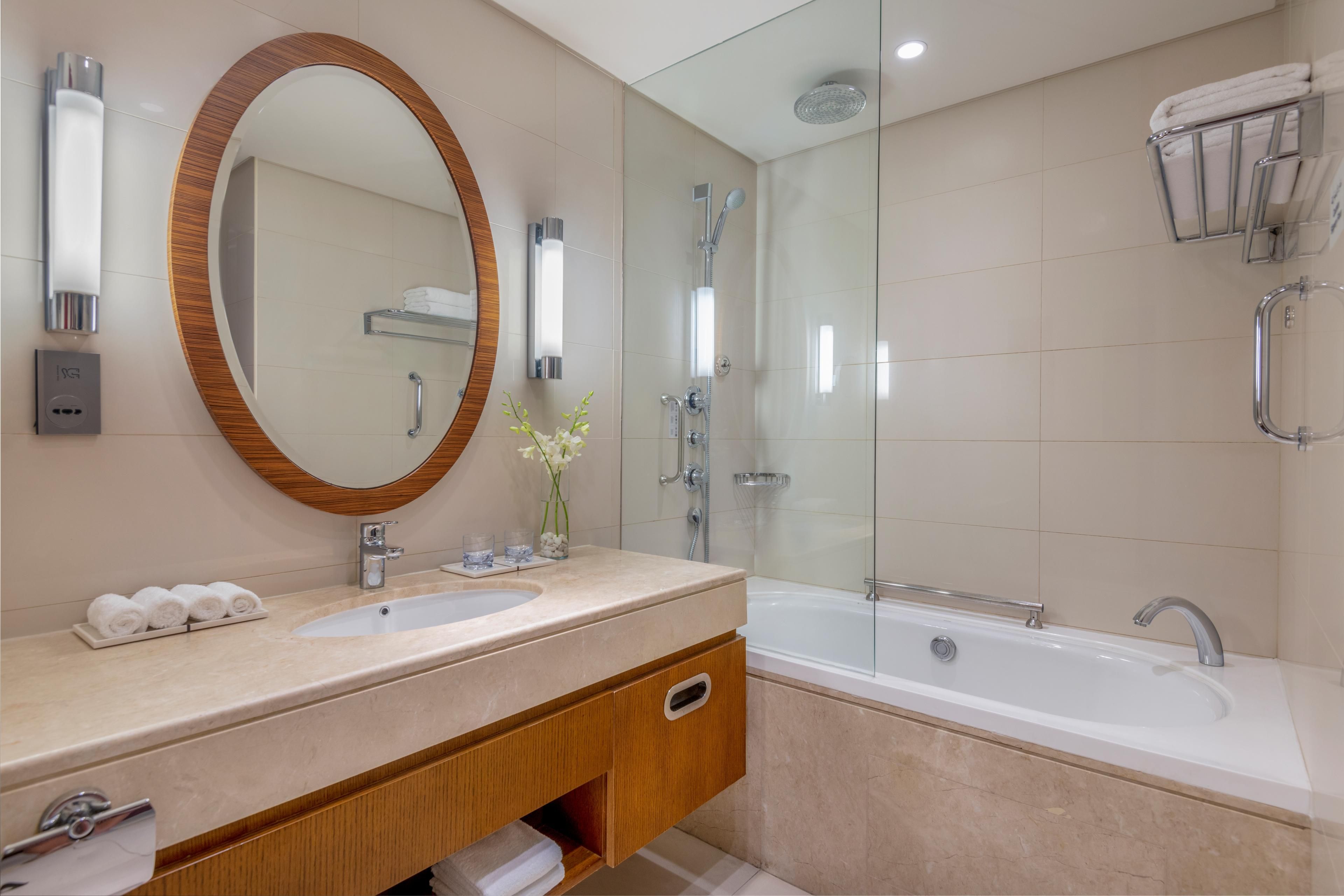 Guest bathroom with bathtub &amp; shower complete with bath amenities