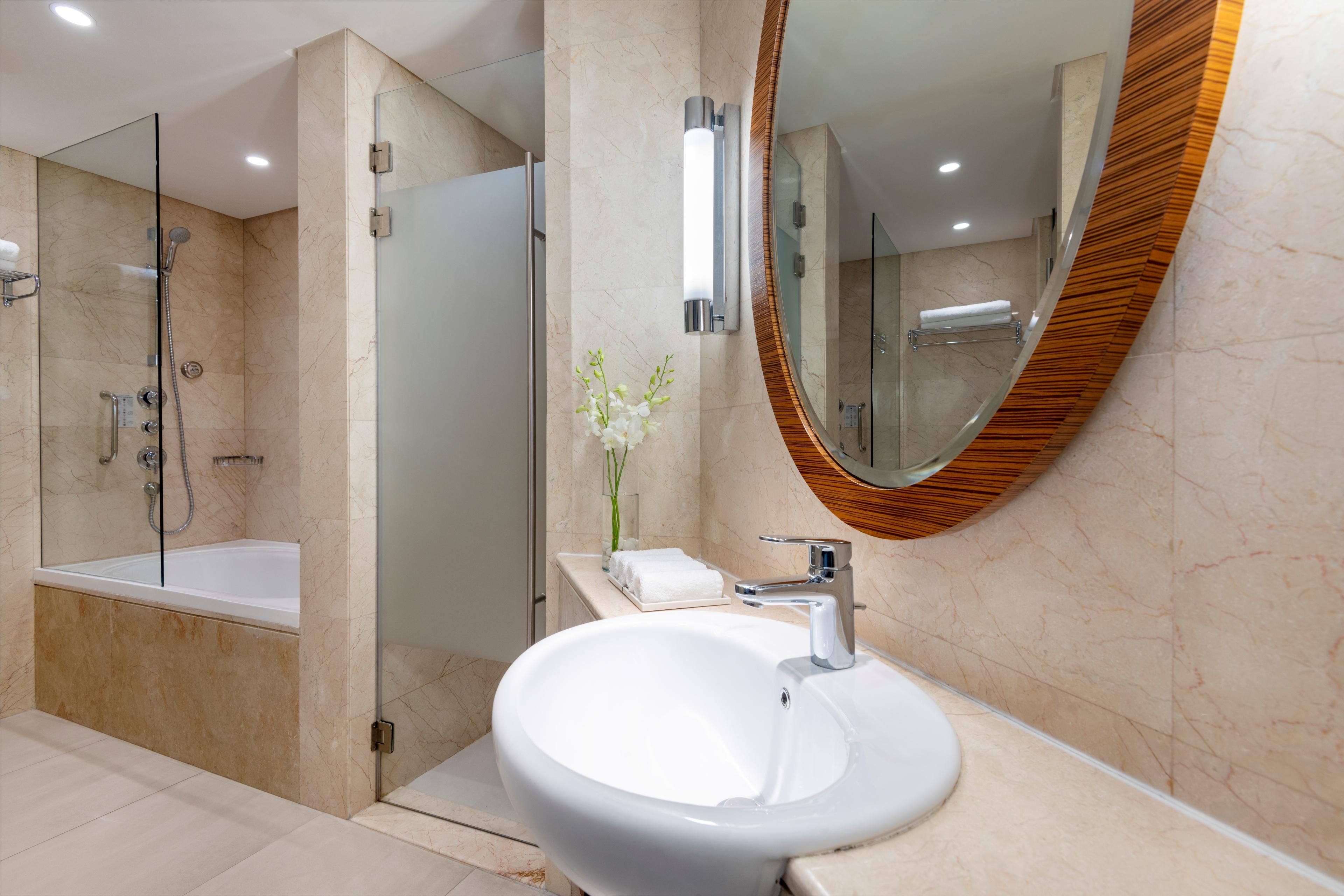 Presidential Suite bathroom features a shower room and a bathtub
