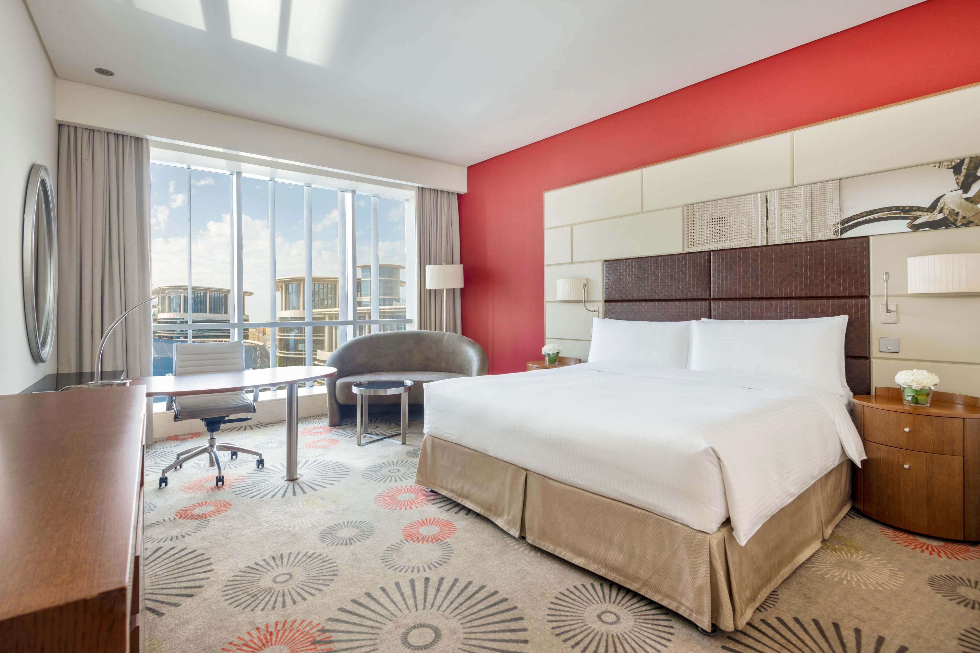 Stay in our well-appointed Deluxe Rooms overlooking the city