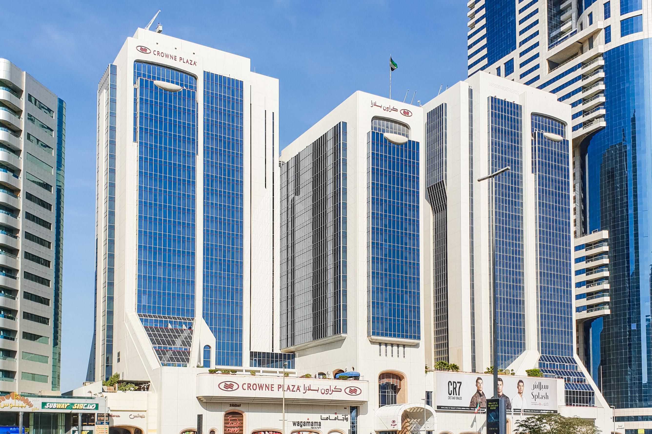 Exterior photo of Crowne Plaza Dubai on a sunny day