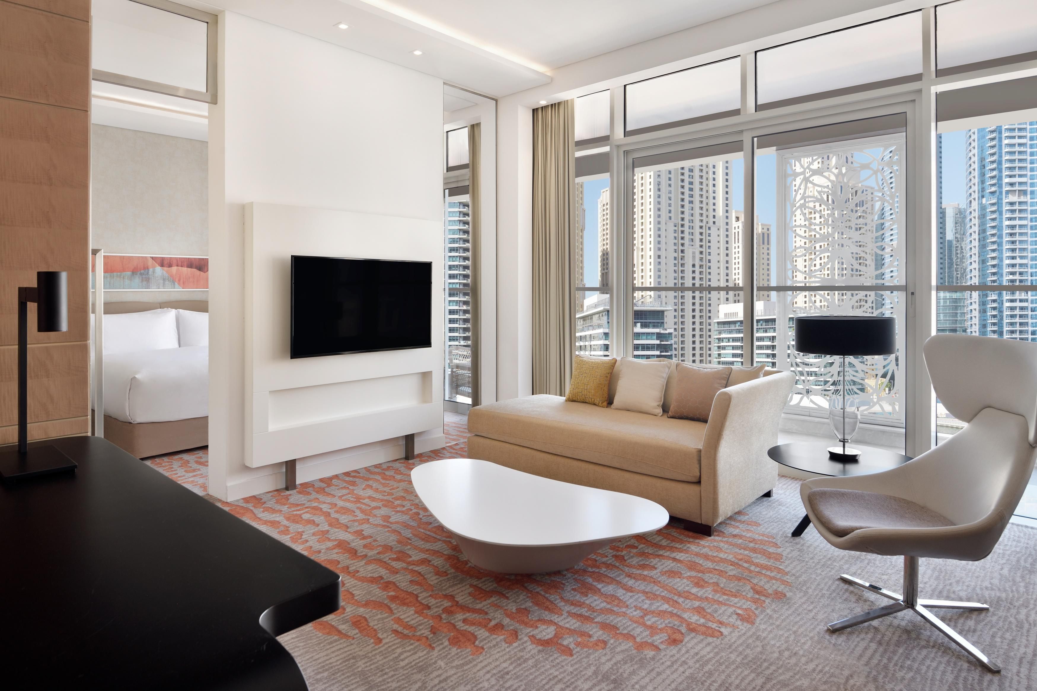 Deluxe Suite Living room with cosmopolitan Dubai Marina view