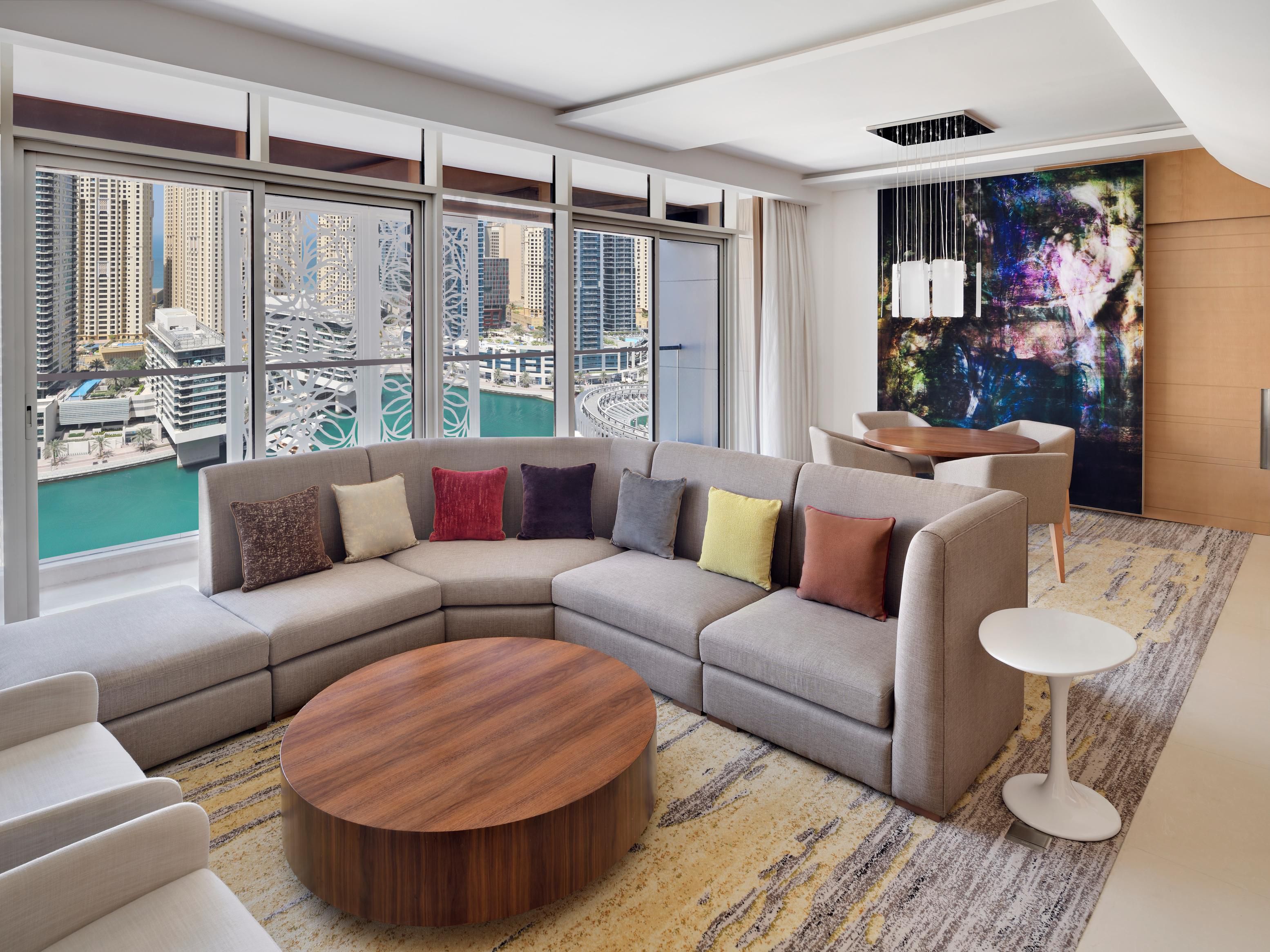 Spacious living area to relax, with balcony overlooking the Marina