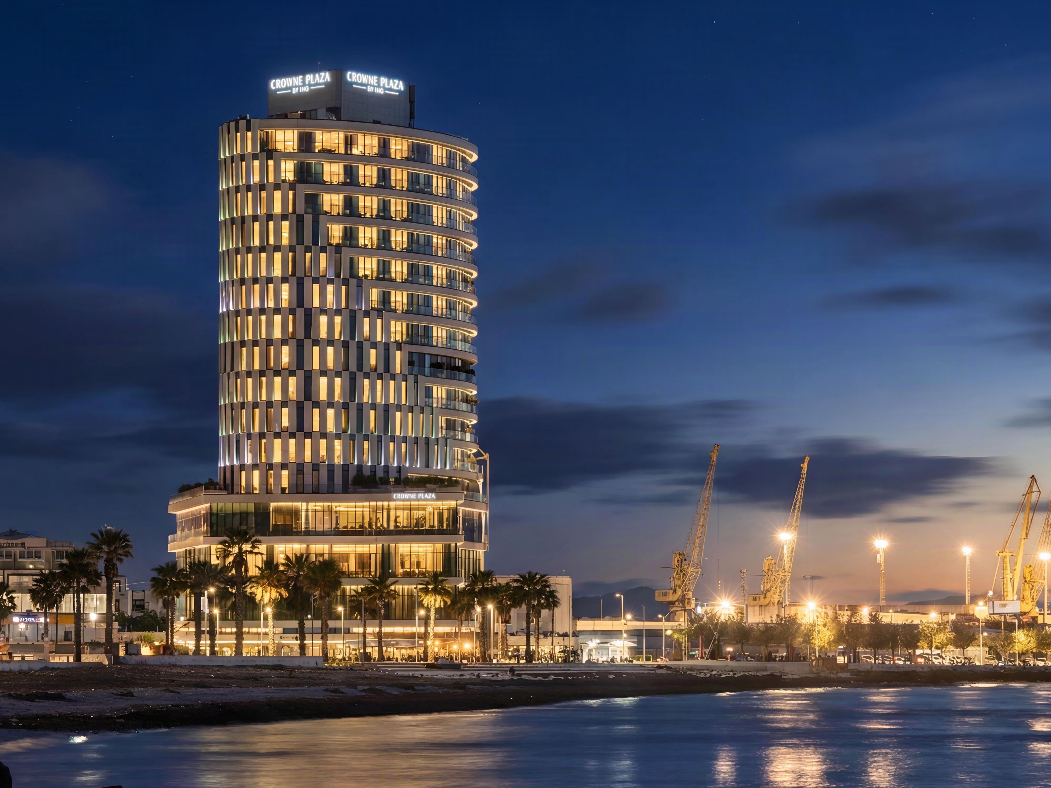 Hotel nestled along the coast, viewed from the sea