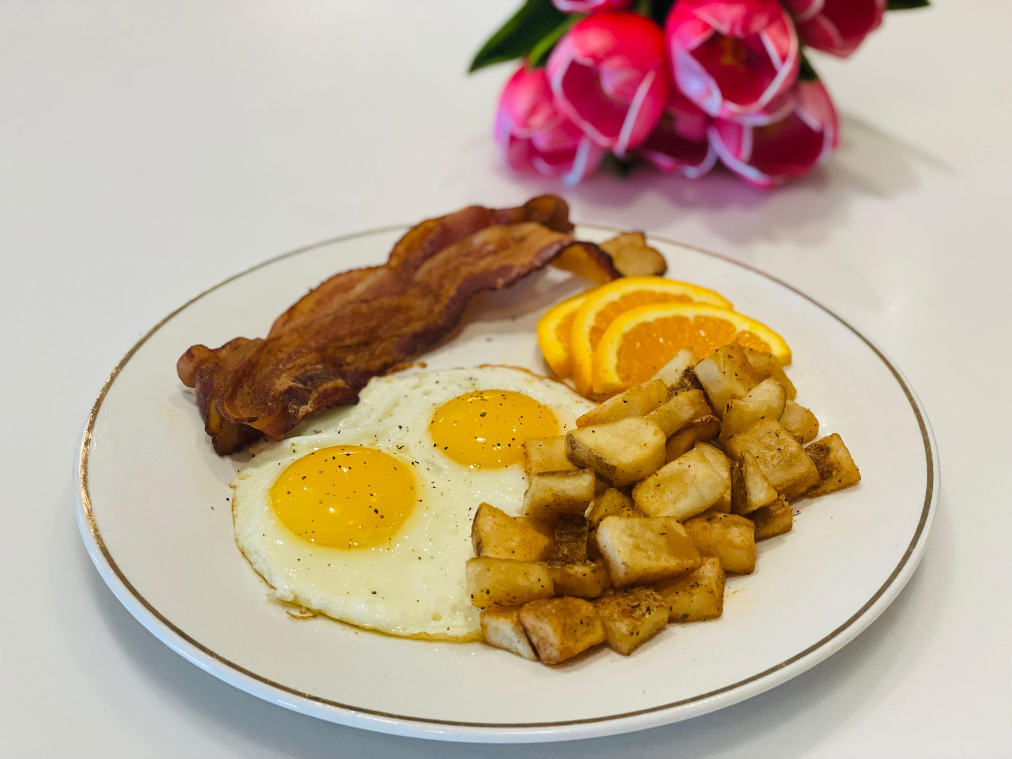 Breakfast plate with bacon and eggs