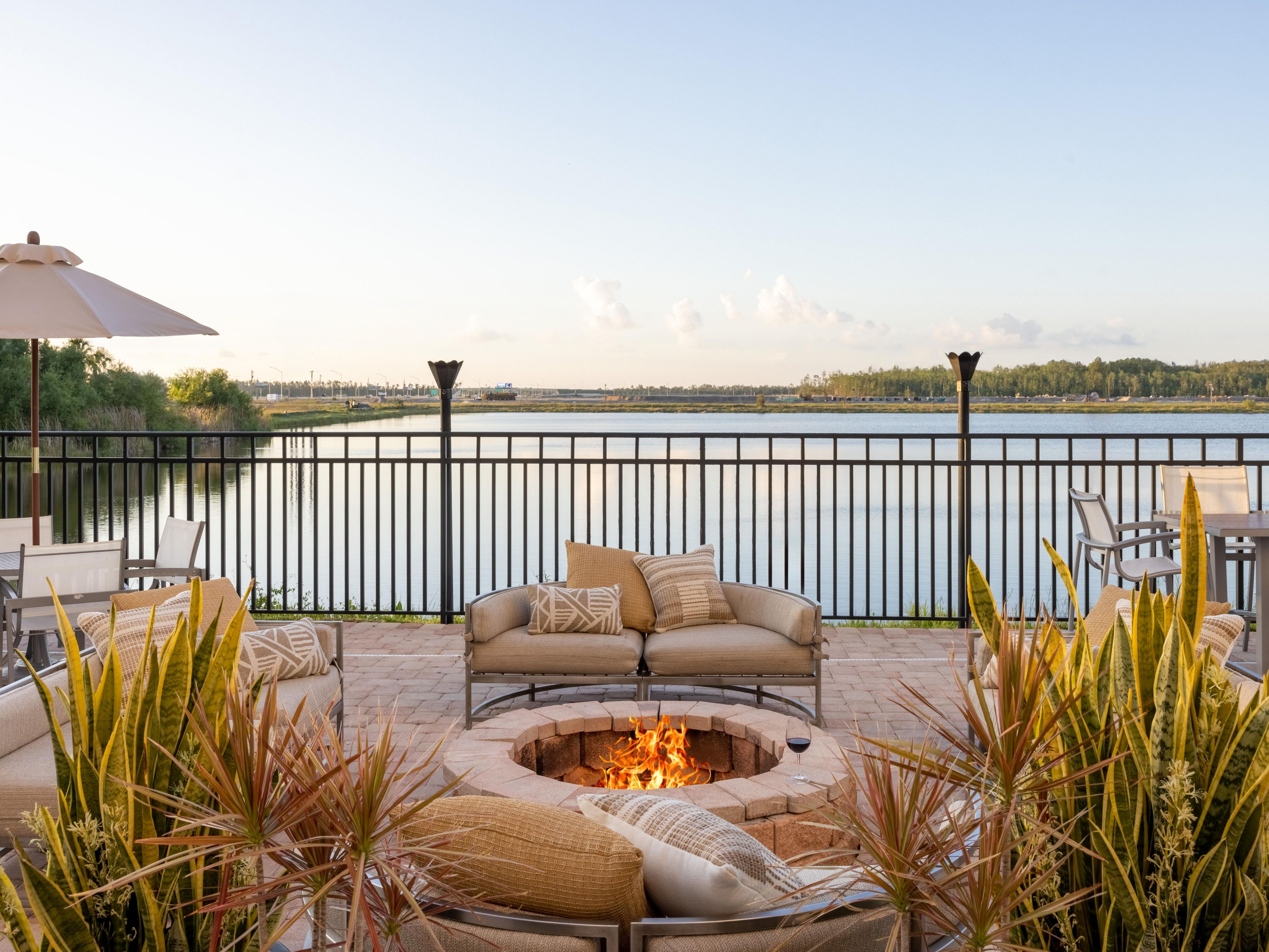 Experience outdoor dining on our lakeside patio, complete with a cozy firepit, providing a serene setting for meals and gatherings.  