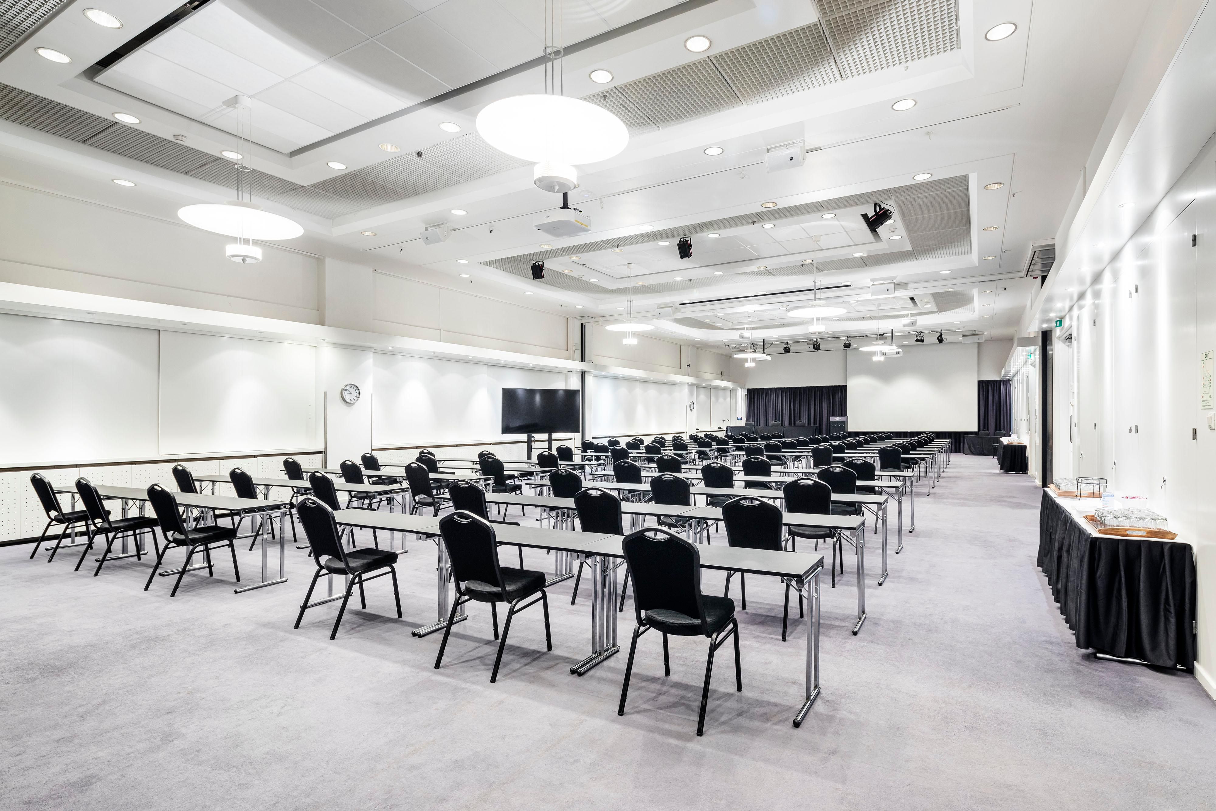 Meeting room Töölö 1-2 with adjusted classroom setup, up to 95 peo