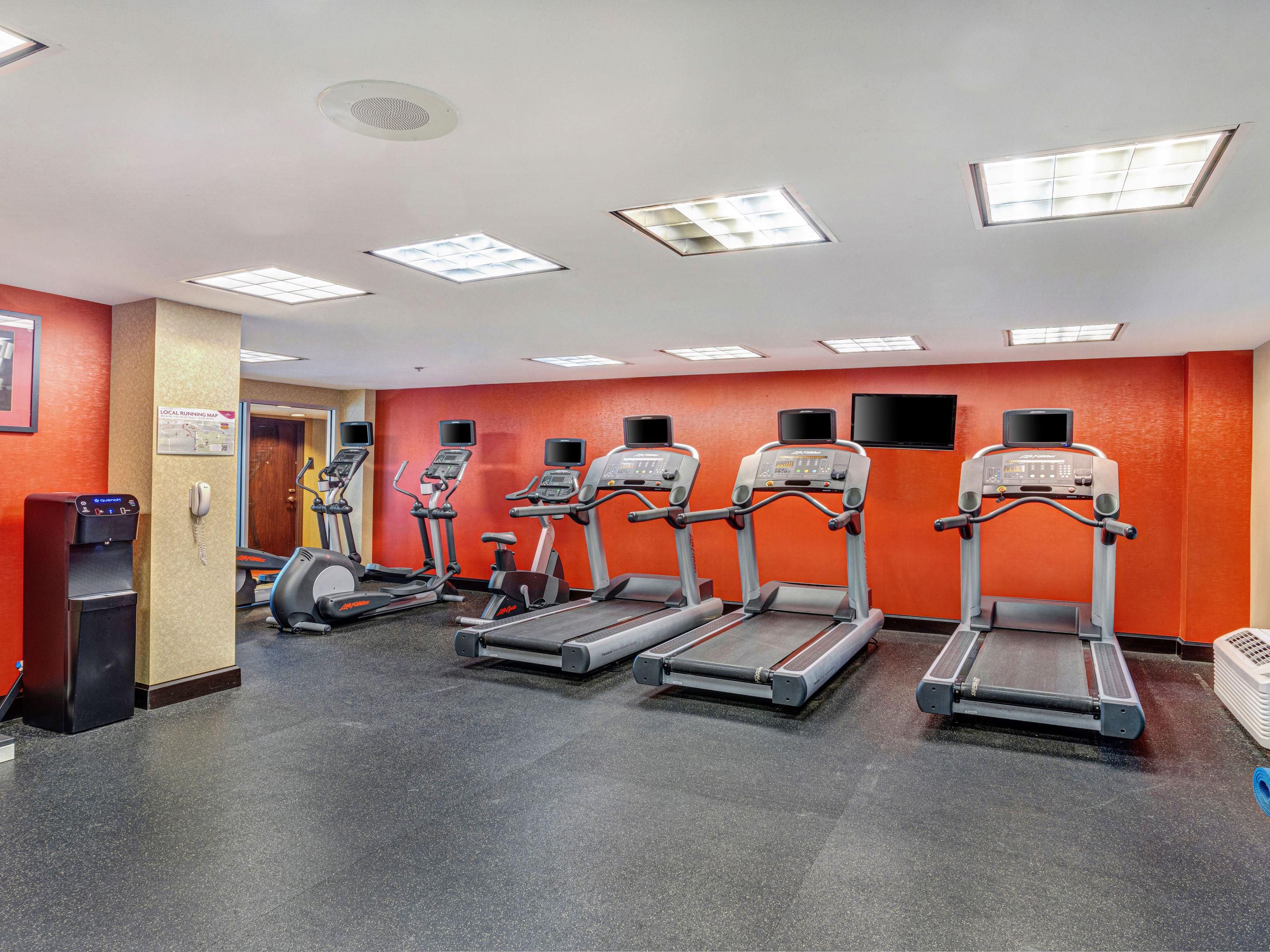 fitness center with cardio equipment