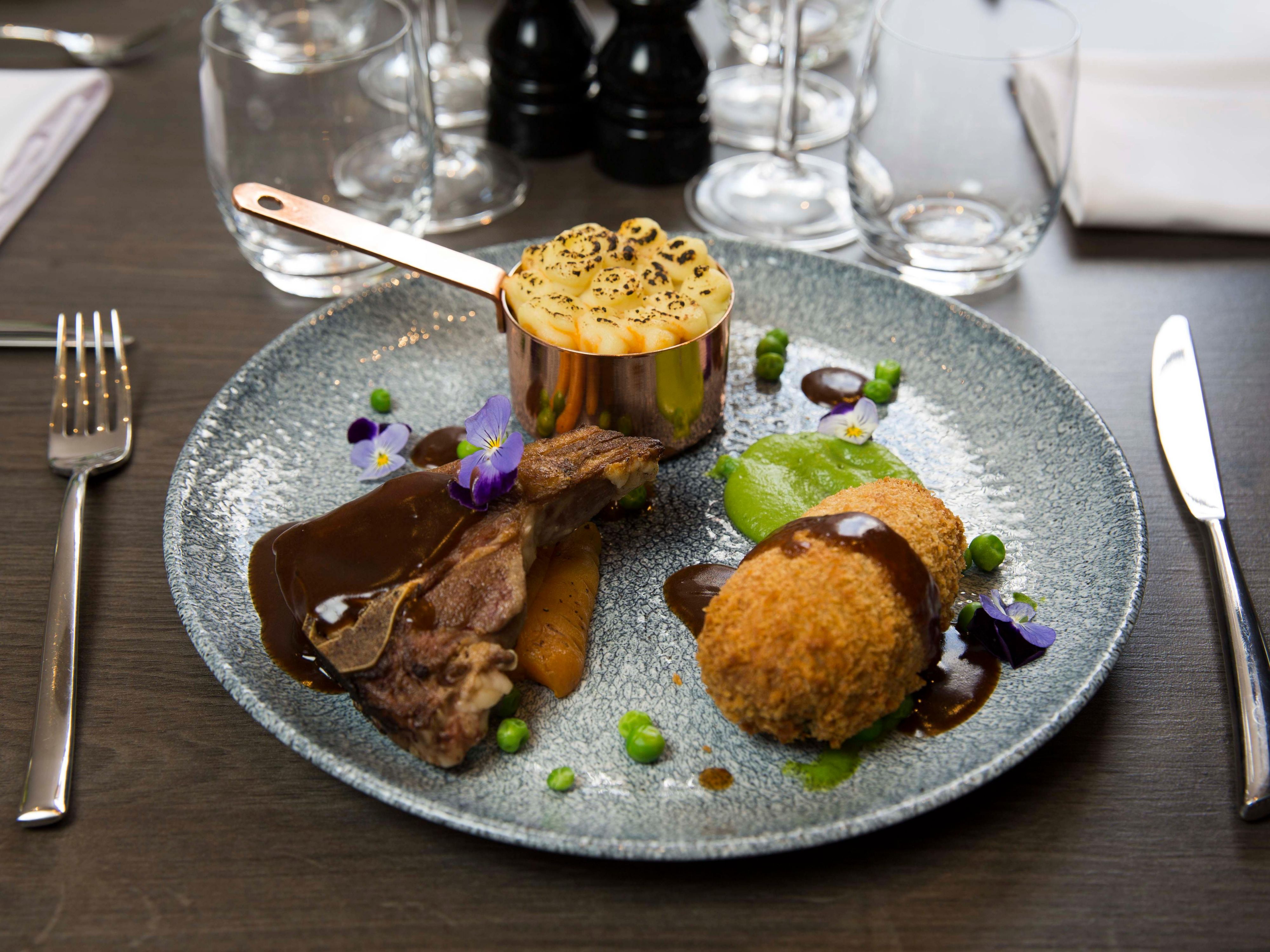 Putting a sprig on dish with wine 