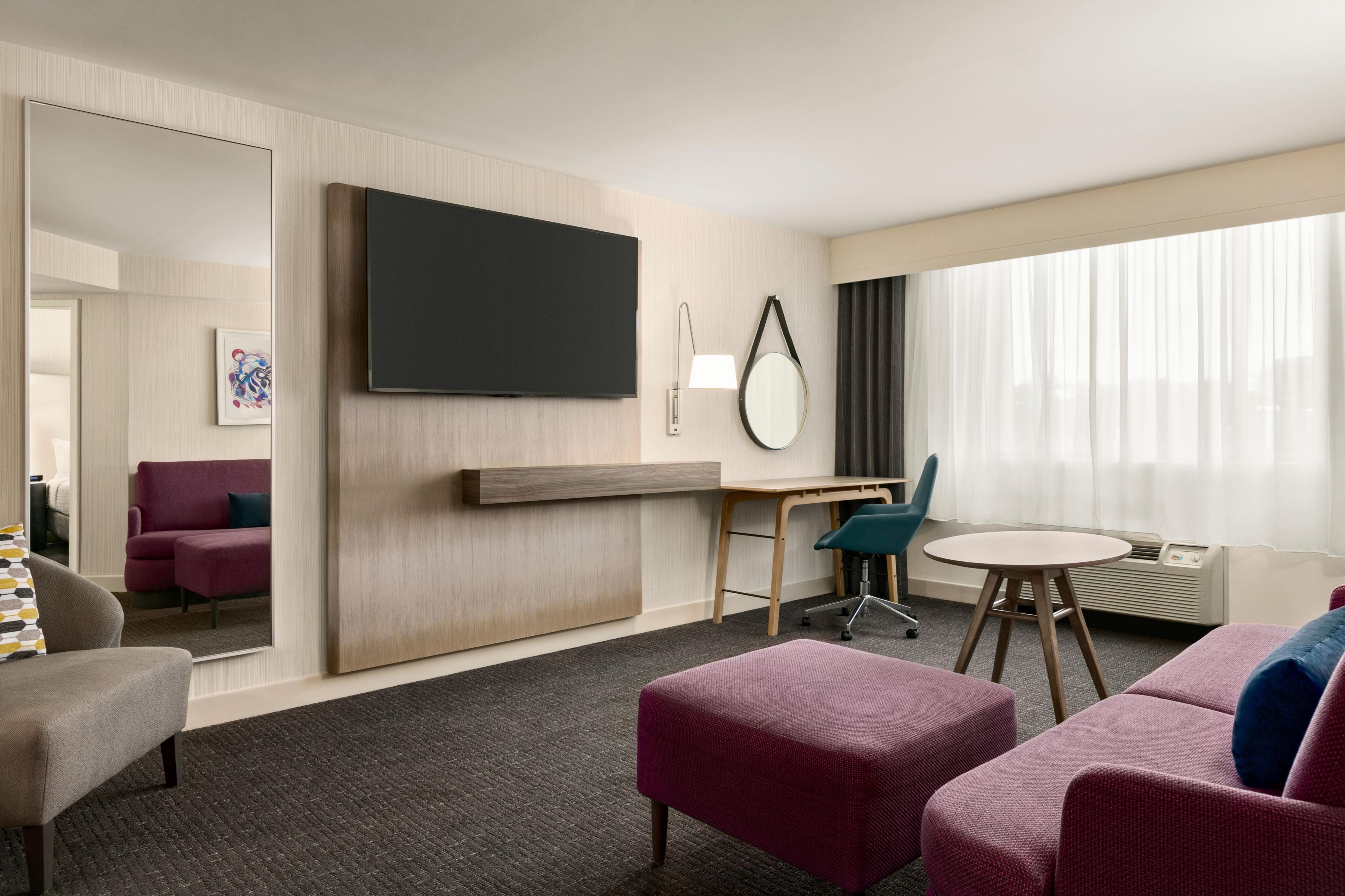 Relax in our King Suite living area featuring a flat screen TV.