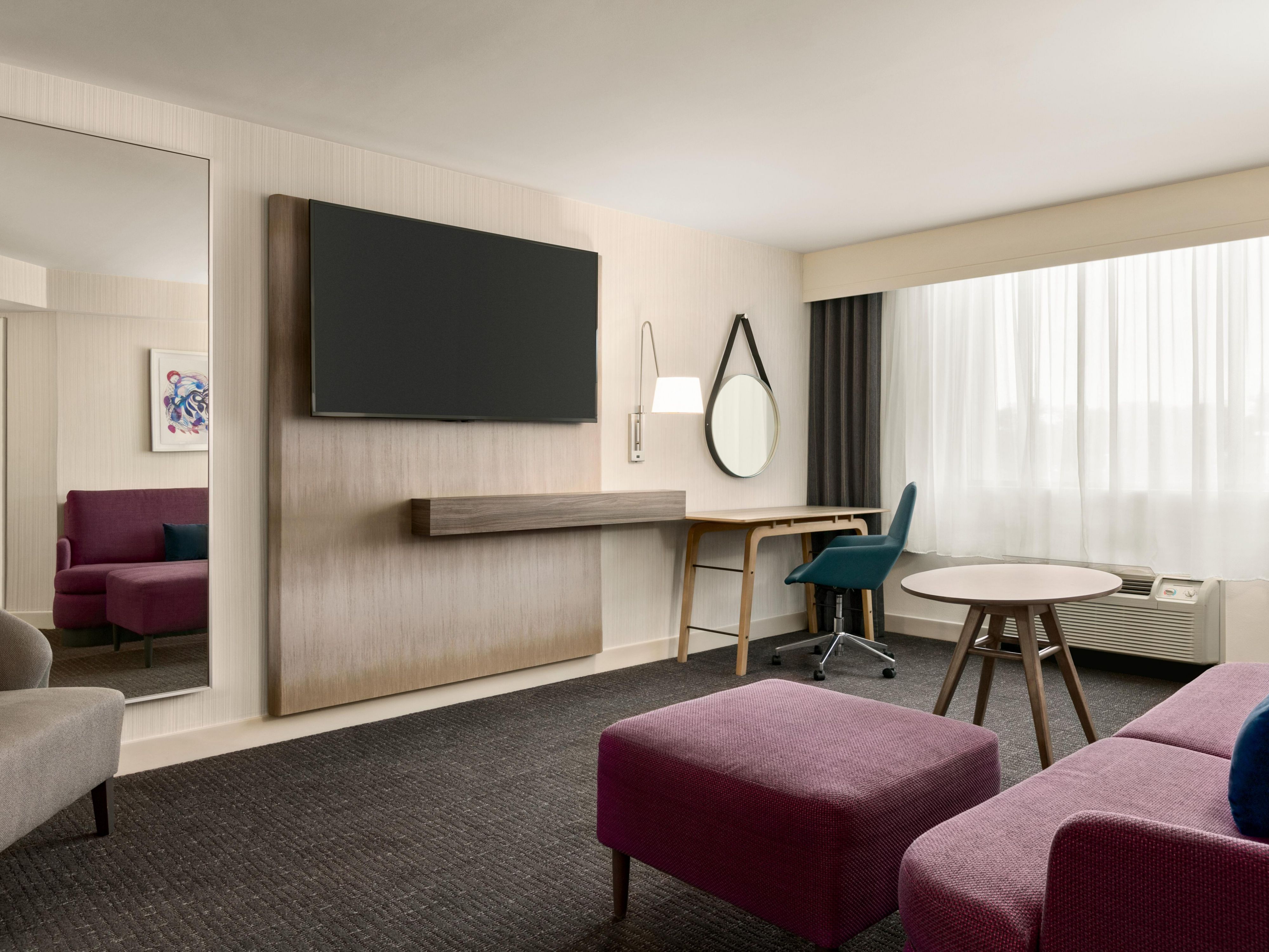 Relax in our King Suite living area featuring a flat screen TV.