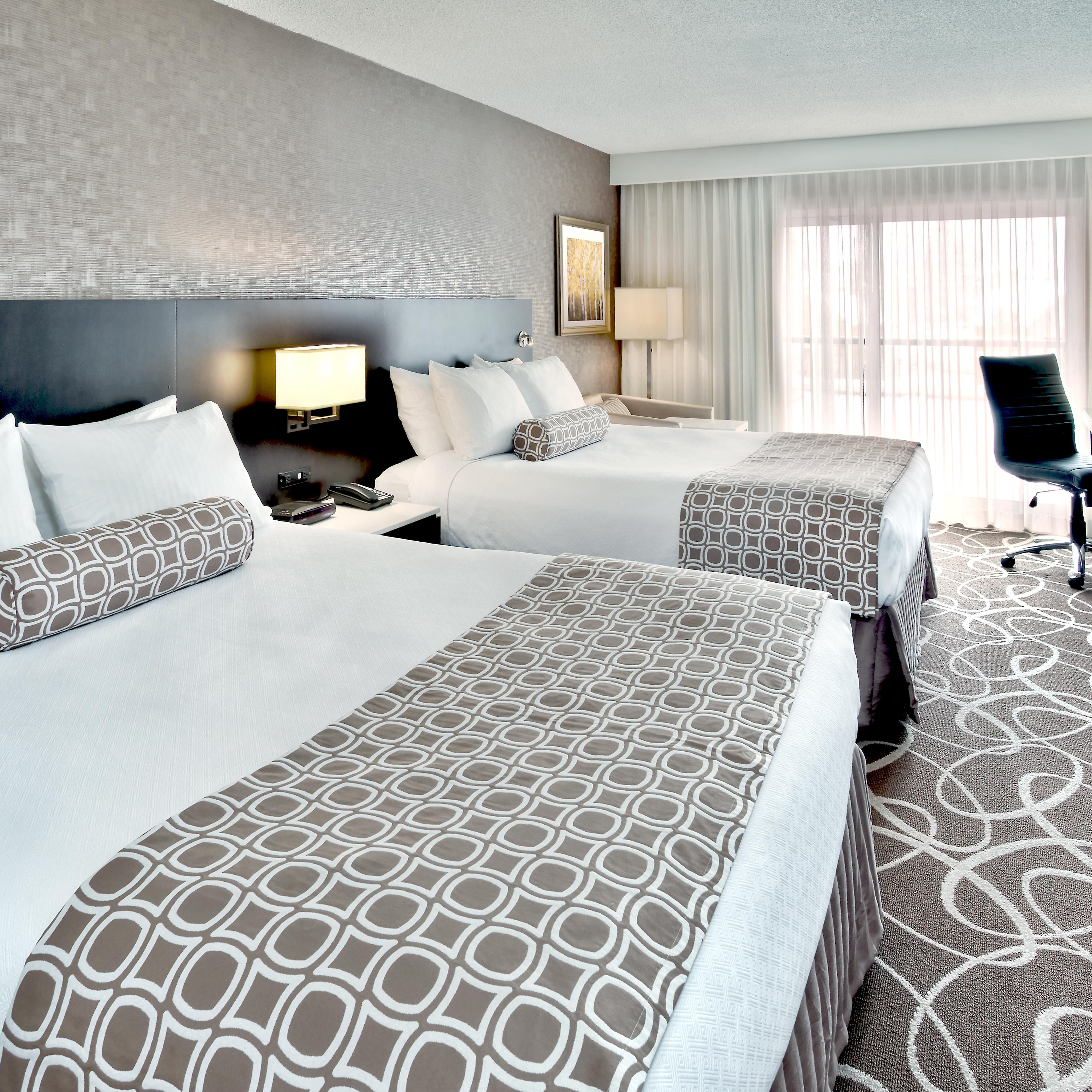 Indulge yourself in our warm, welcoming Deluxe Two Queen Bed  Room