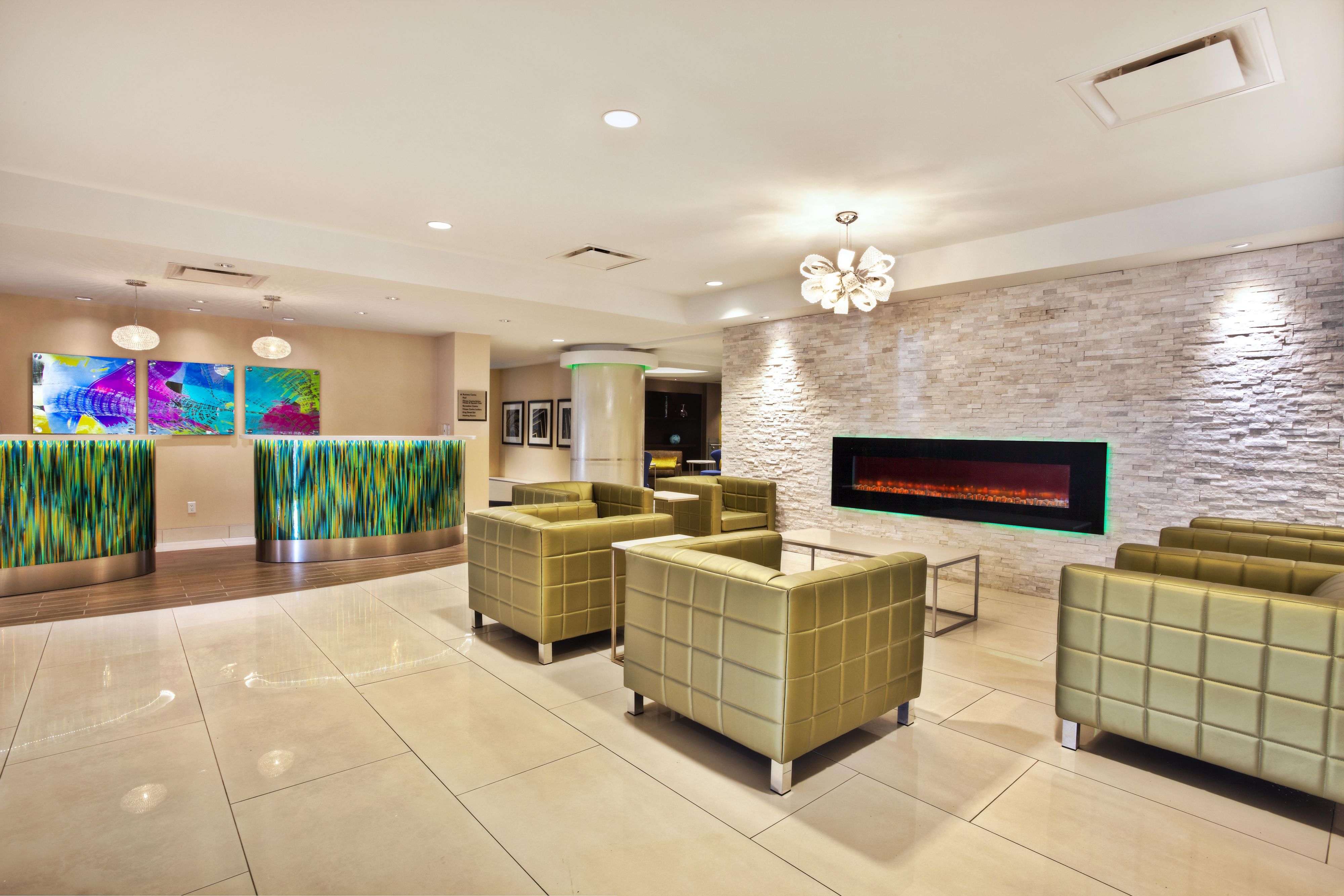 Relax by our lobby&#39;s fireplace