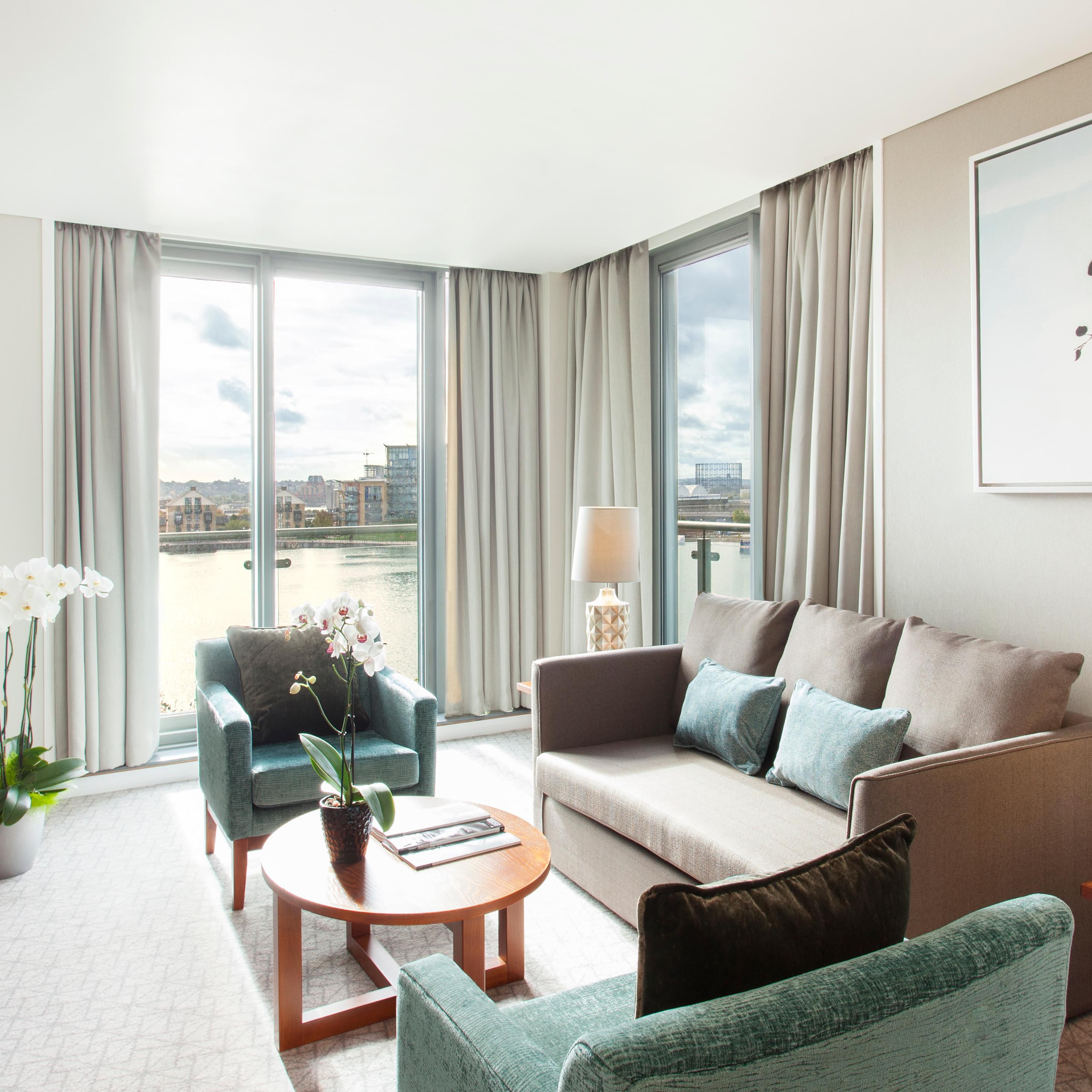 Executive suite living area with panoramic views of the river