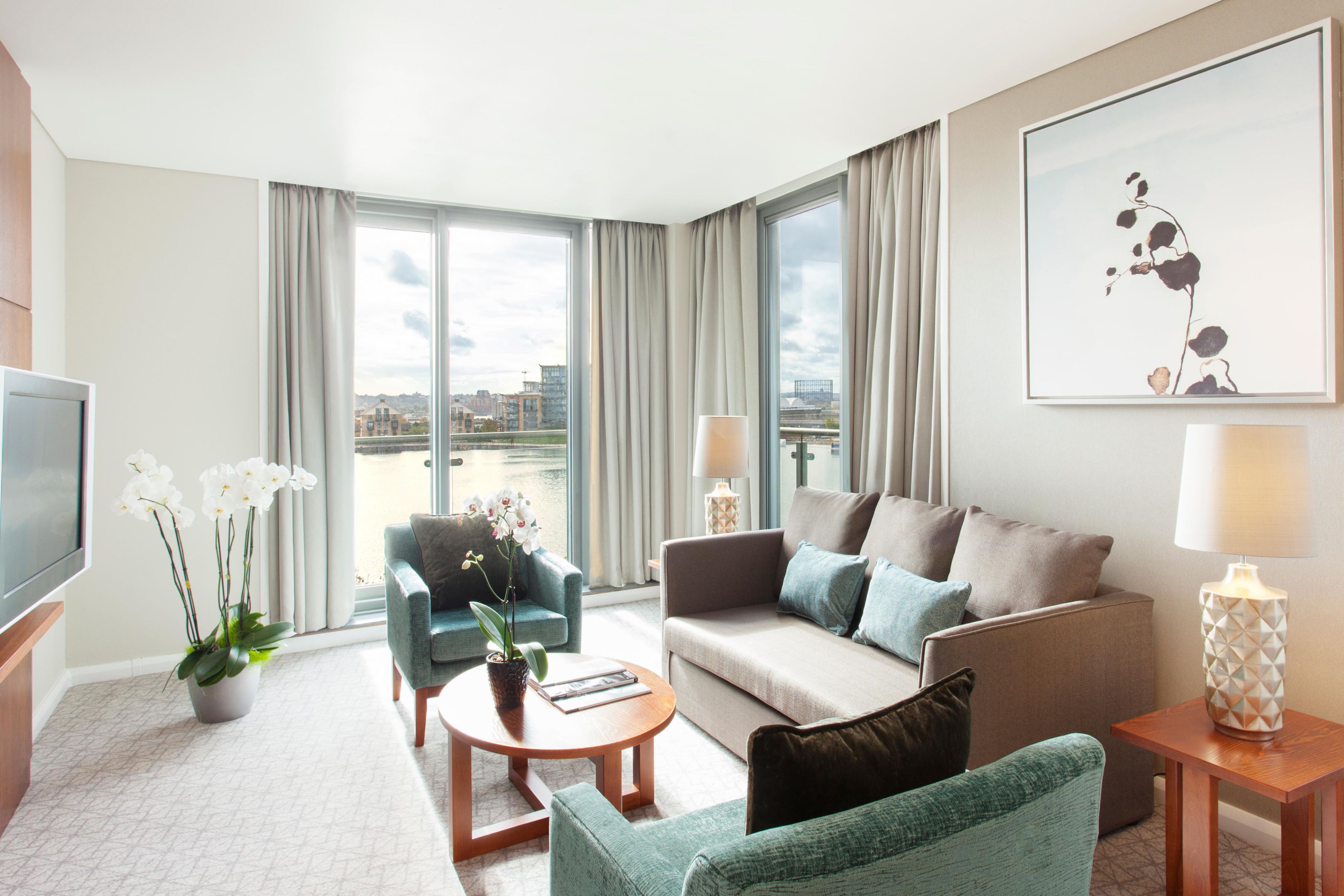 Executive suite living area with panoramic views of the river
