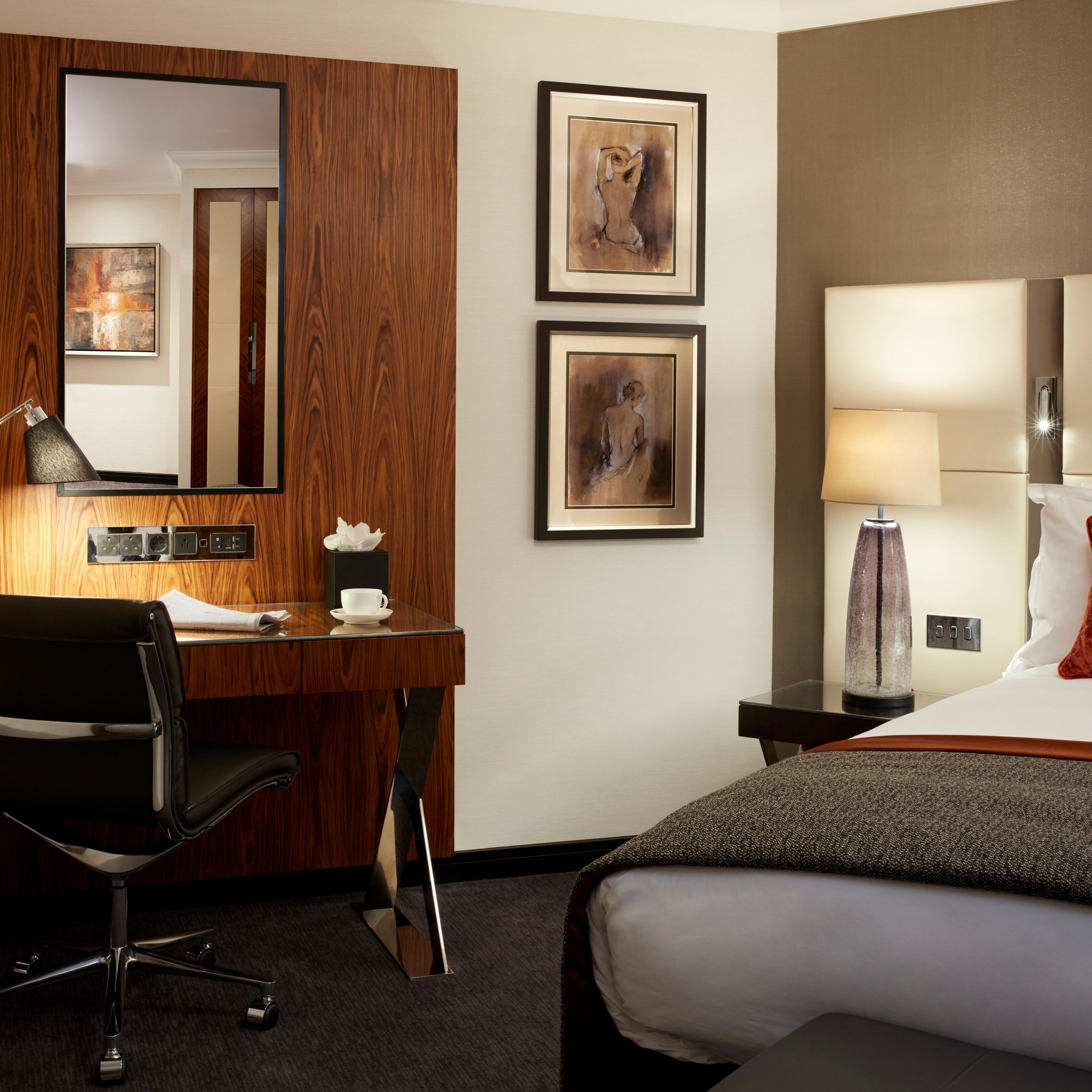 Each of our guest rooms has a large working desk with media hub