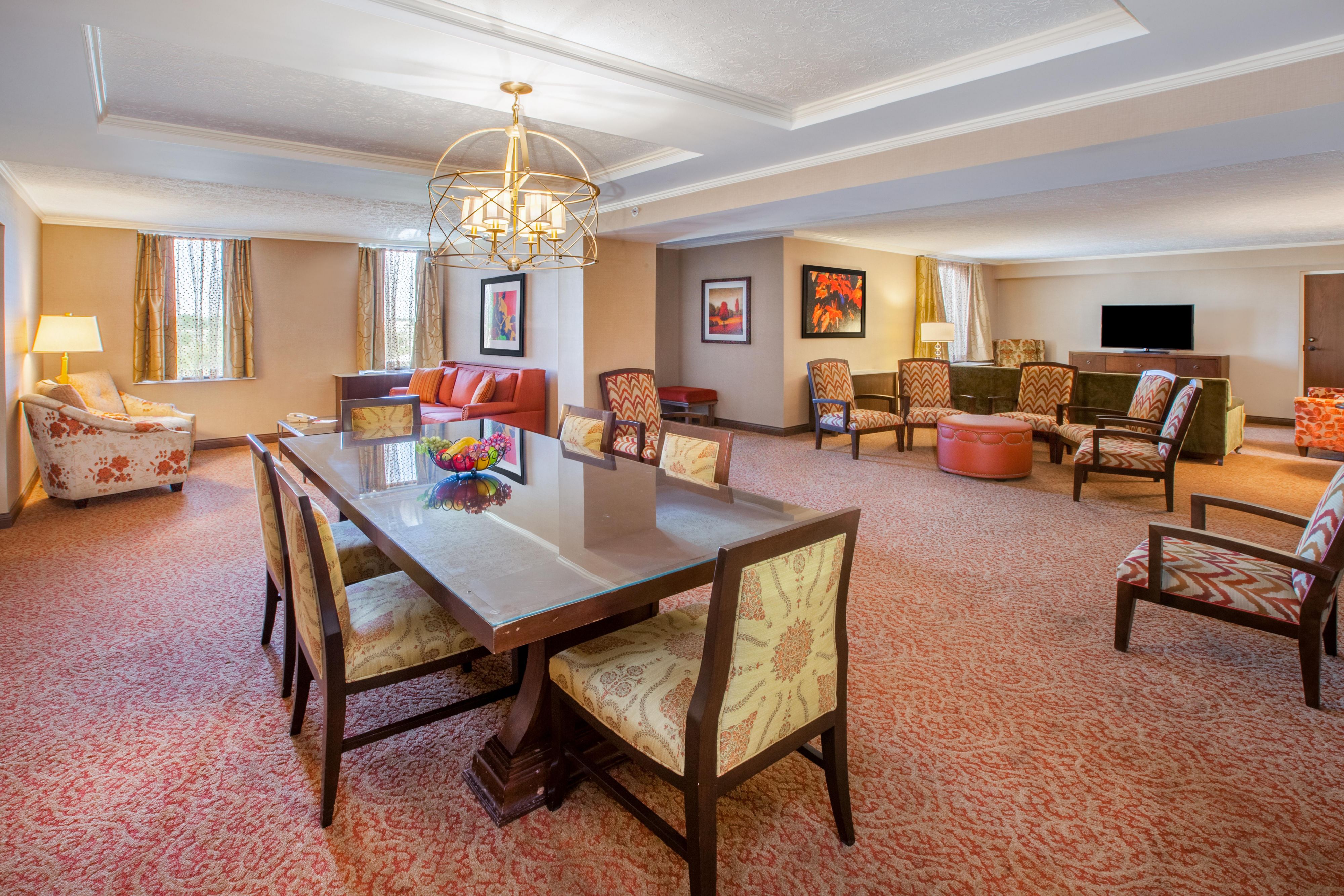 Presidential Suite with Extensive Sectional Seating and Table