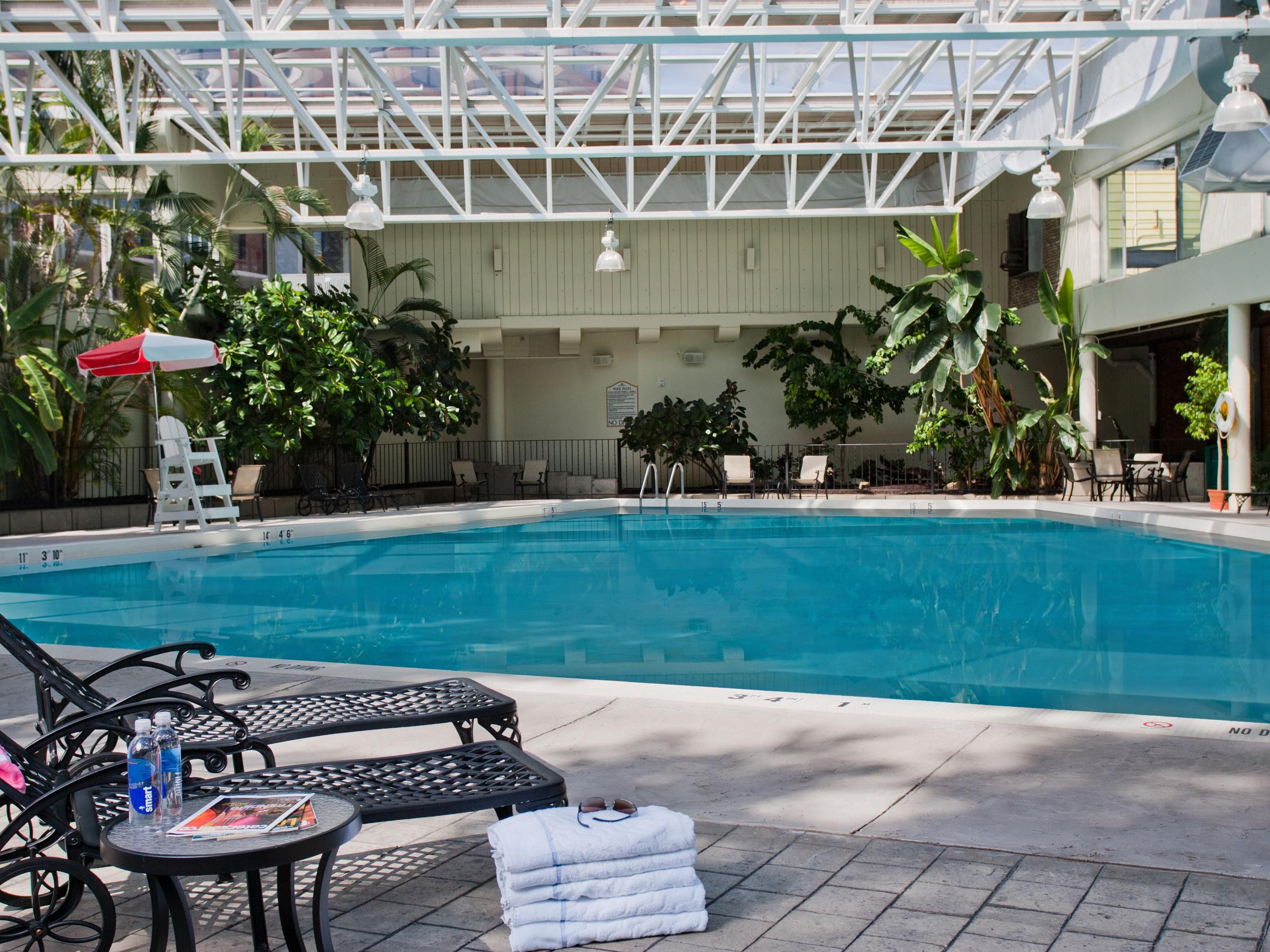 Take a splash and cool down in our tropical indoor/outdoor pool. Whether you enjoy swimming laps, relaxing poolside, or suntanning out on our pool deck. In season, our pool is under cover but with an open wall to our outdoor pool deck. Once the chilly weather hits, it becomes a heated and enclosed oasis! Pool use is restricted to hotel guests only.