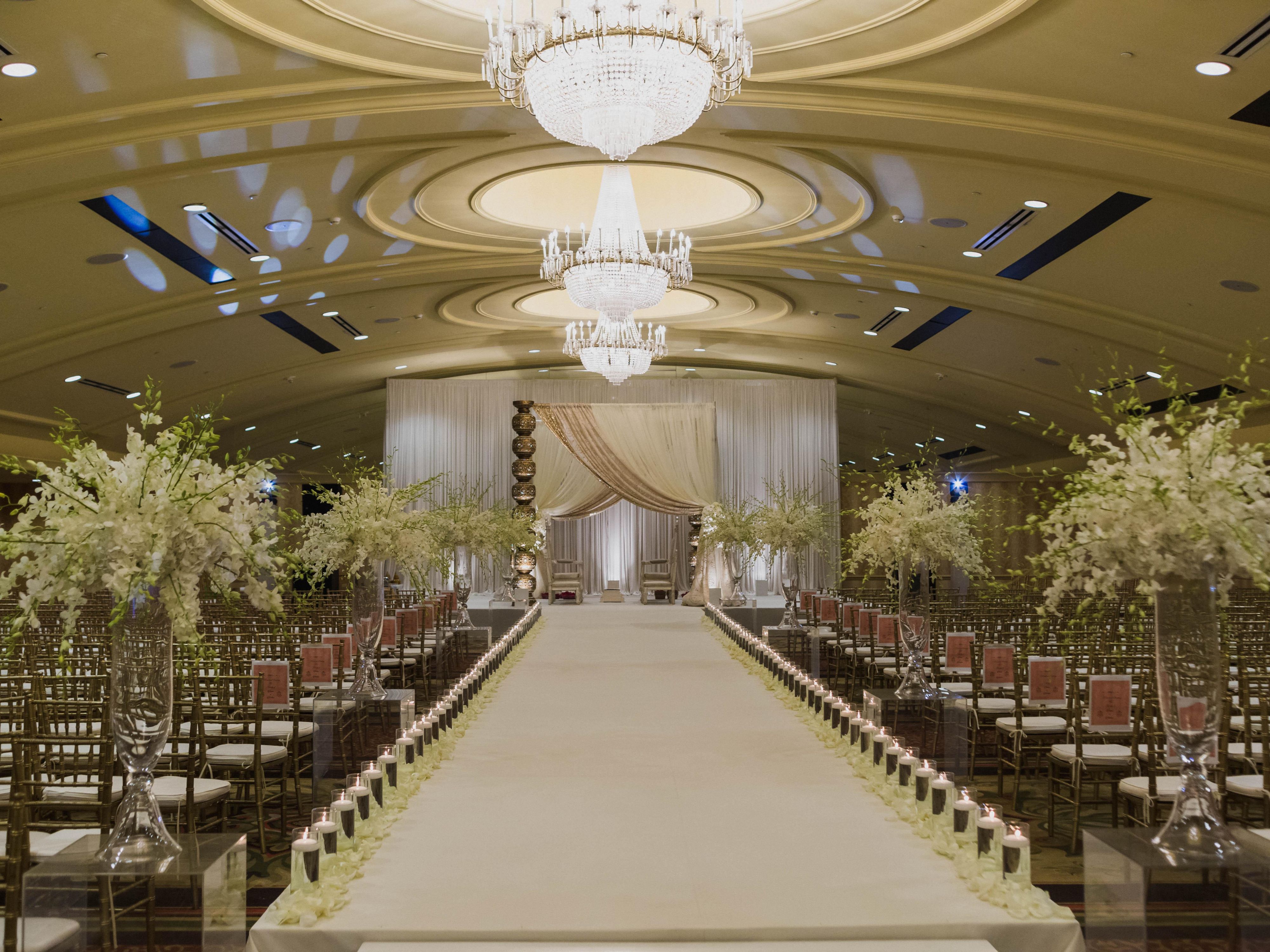 Wedding venue with plenty of seating and walkway leading up to the alter