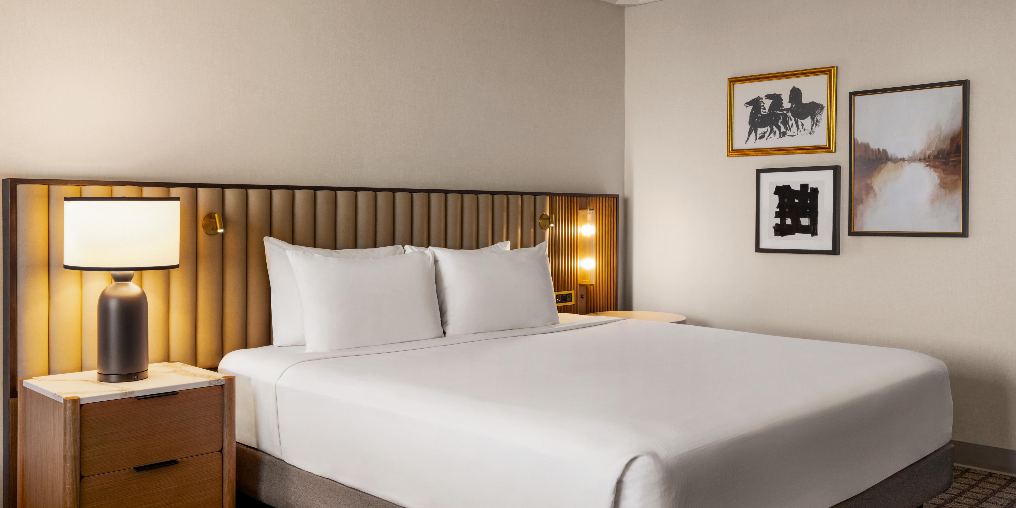 King bed hotel room with couch