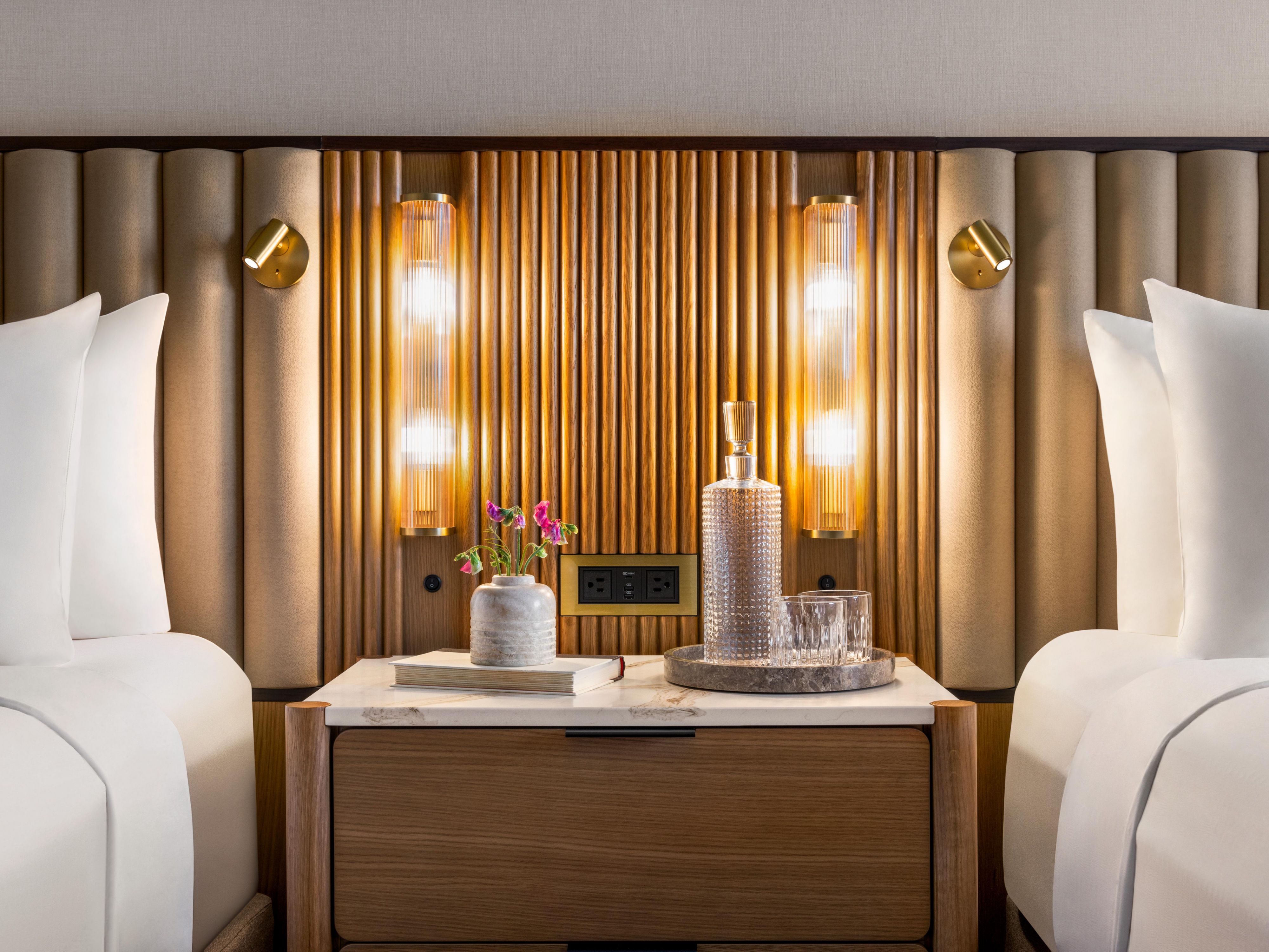 Two beds divided by a table