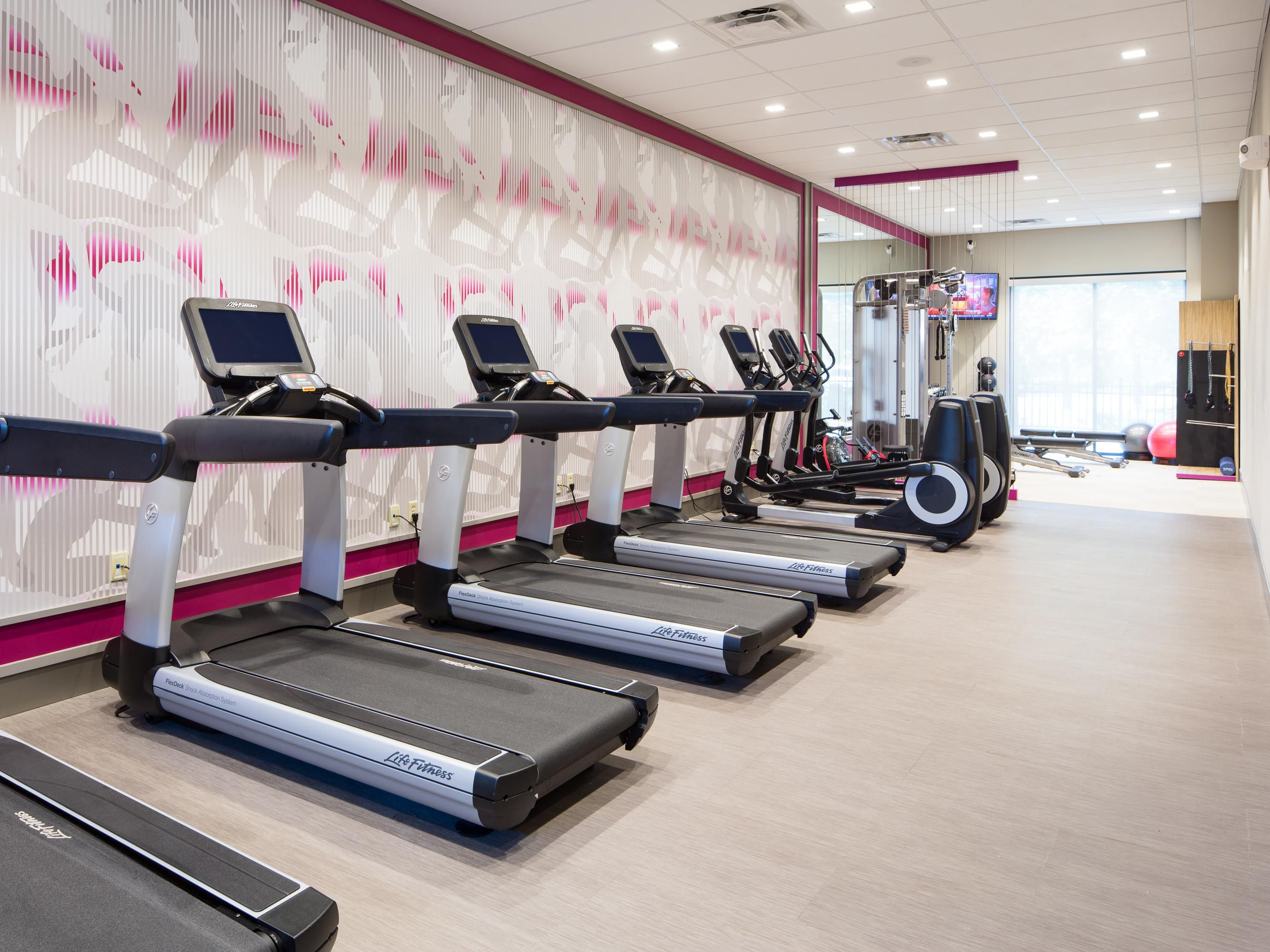 fitness center with cardio equipment