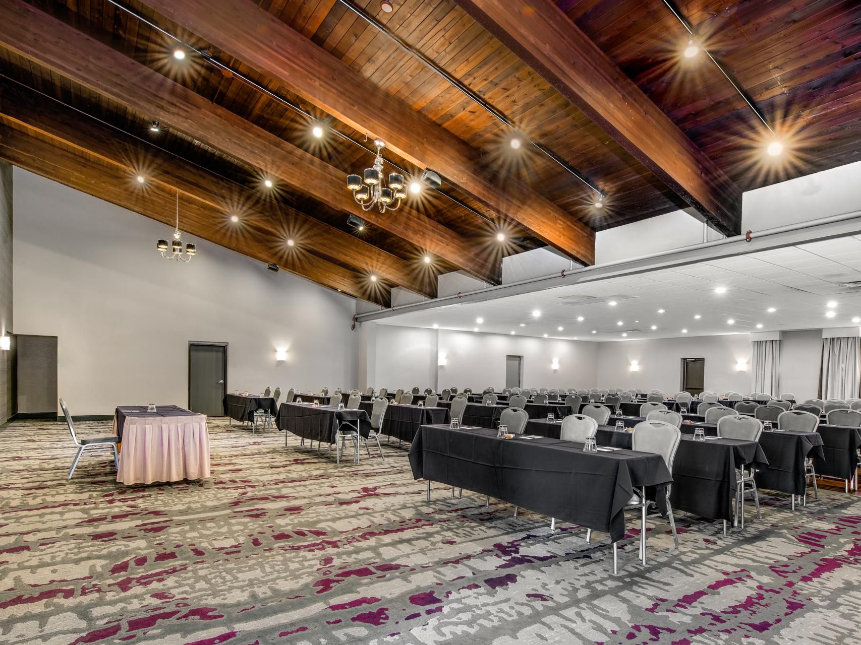 Meeting room set up with tables and chairs