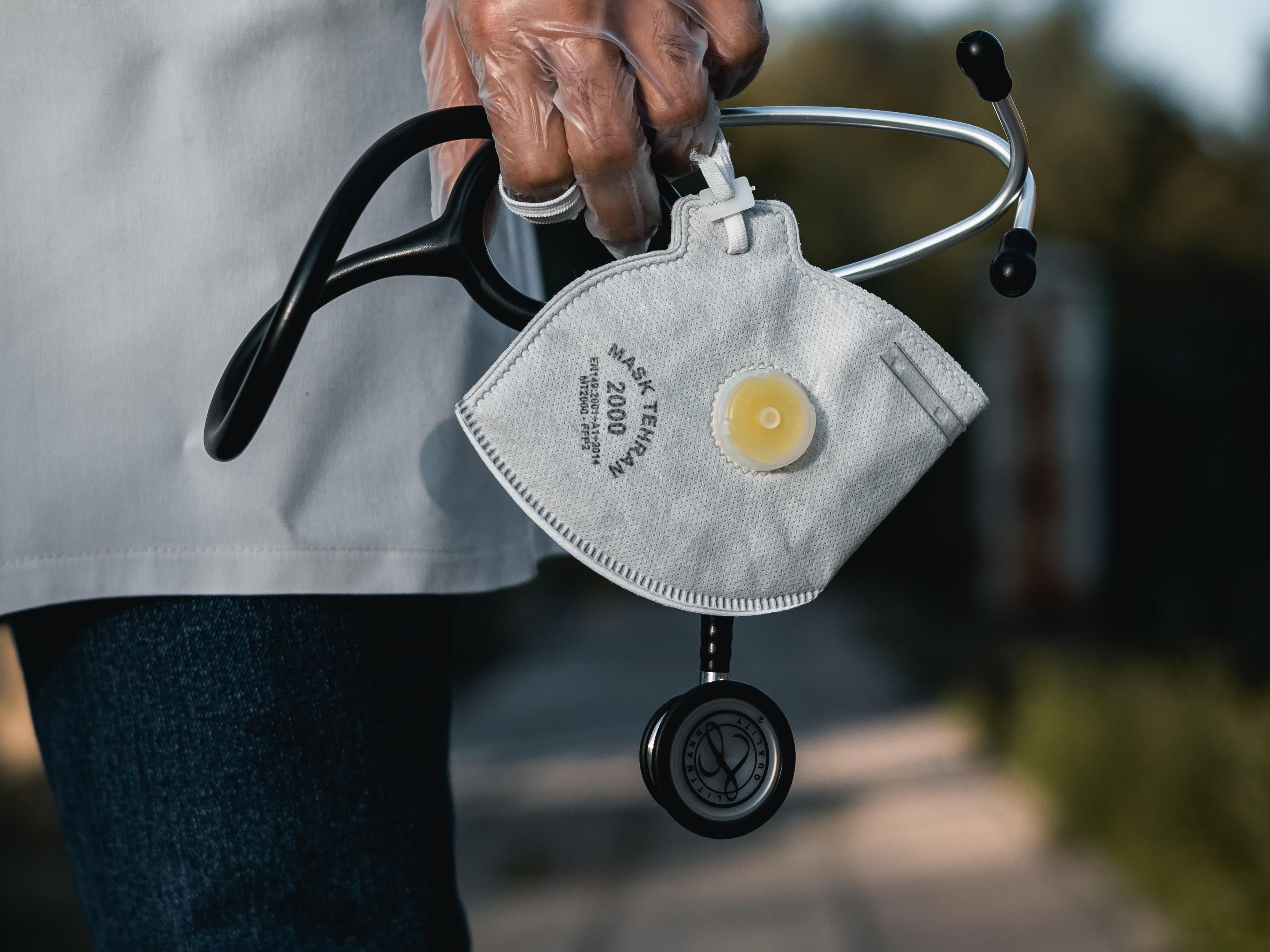 doctor holding mask 