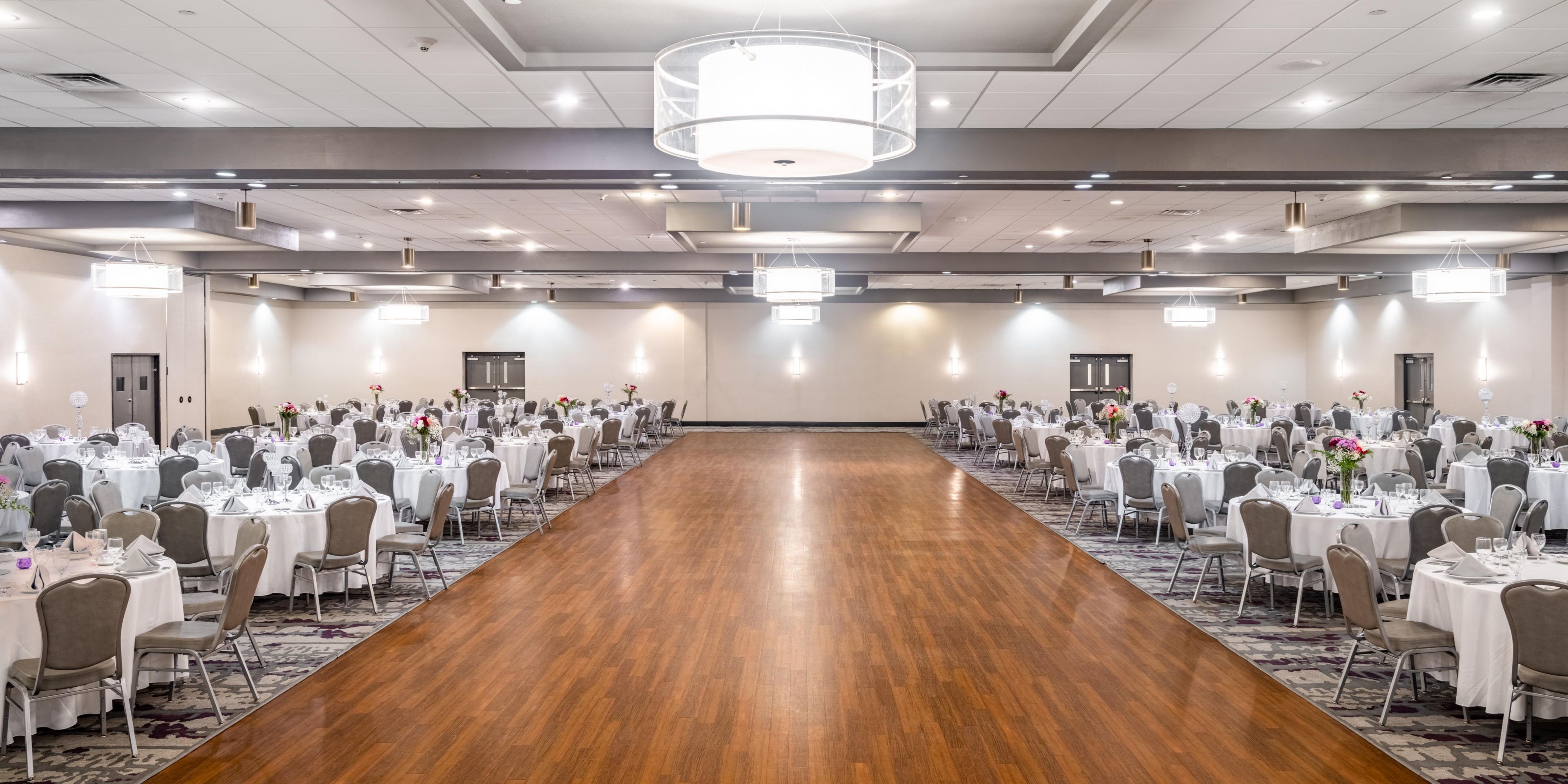 Ballroom with round tables and large center space